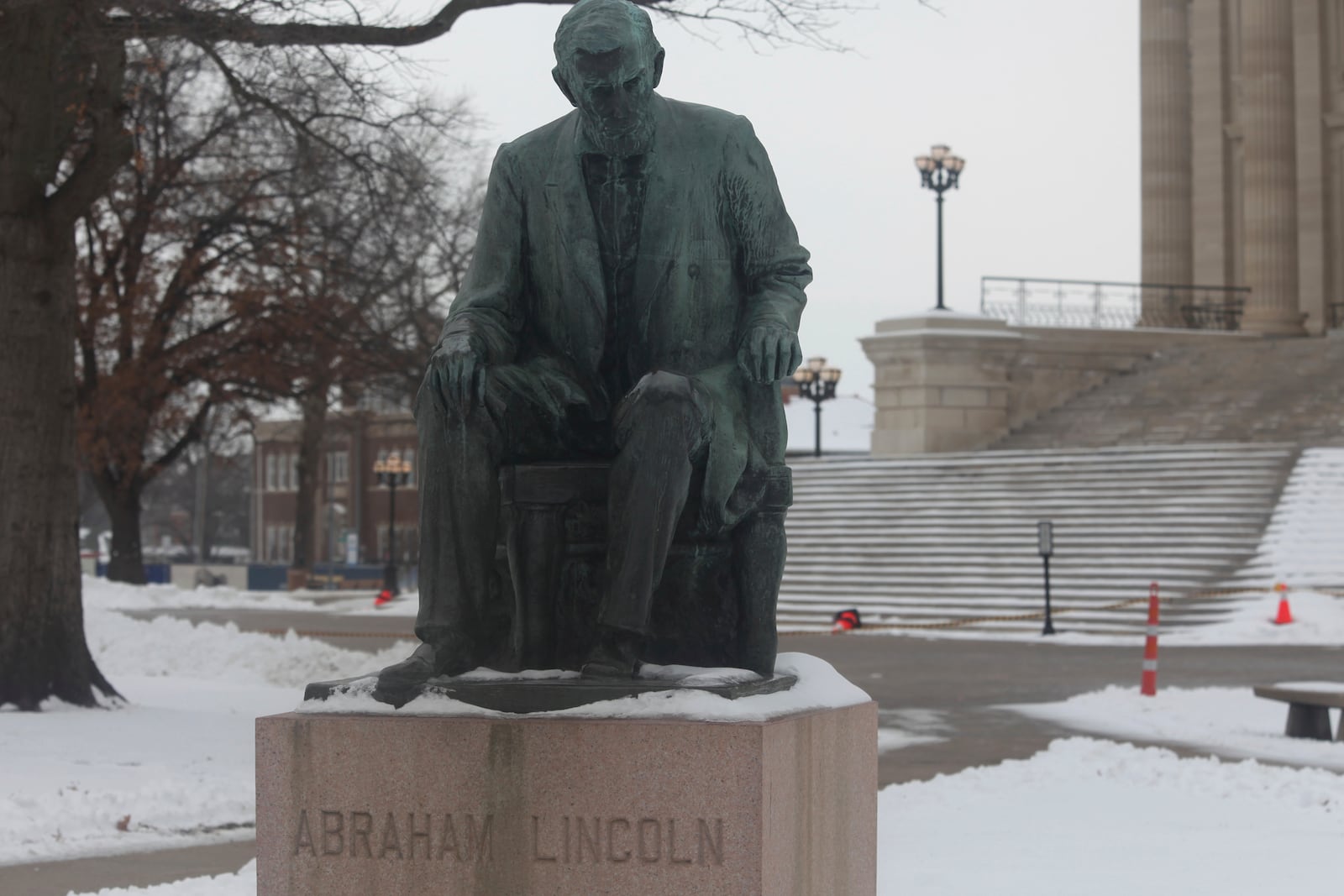 A statue on the Kansas Statehouse grounds honors Abraham Lincoln, the 16th U.S. president, who kept the Union intact during the Civil War, Friday, Feb. 14, 2025, in Topeka, Kansas. (AP Photo/John Hanna)