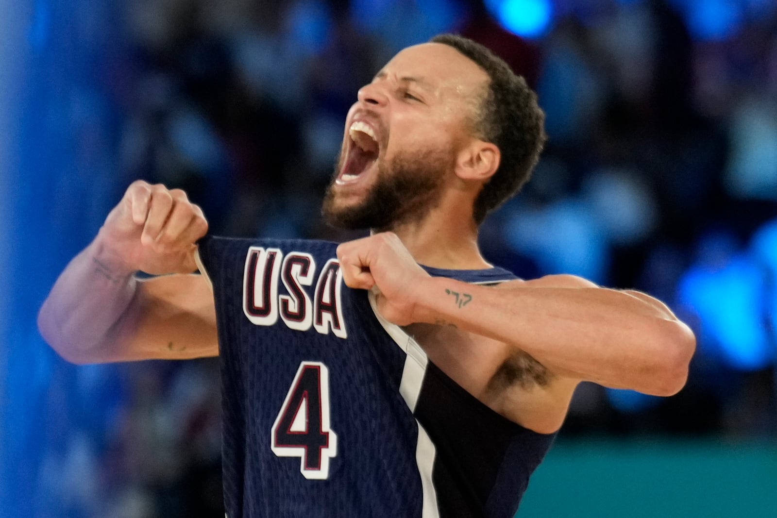 FILE - United States' Stephen Curry (4) celebrates after beating France to win the gold medal during a men's gold medal basketball game at Bercy Arena at the 2024 Summer Olympics, Saturday, Aug. 10, 2024, in Paris, France. (AP Photo/Mark J. Terrill, File)