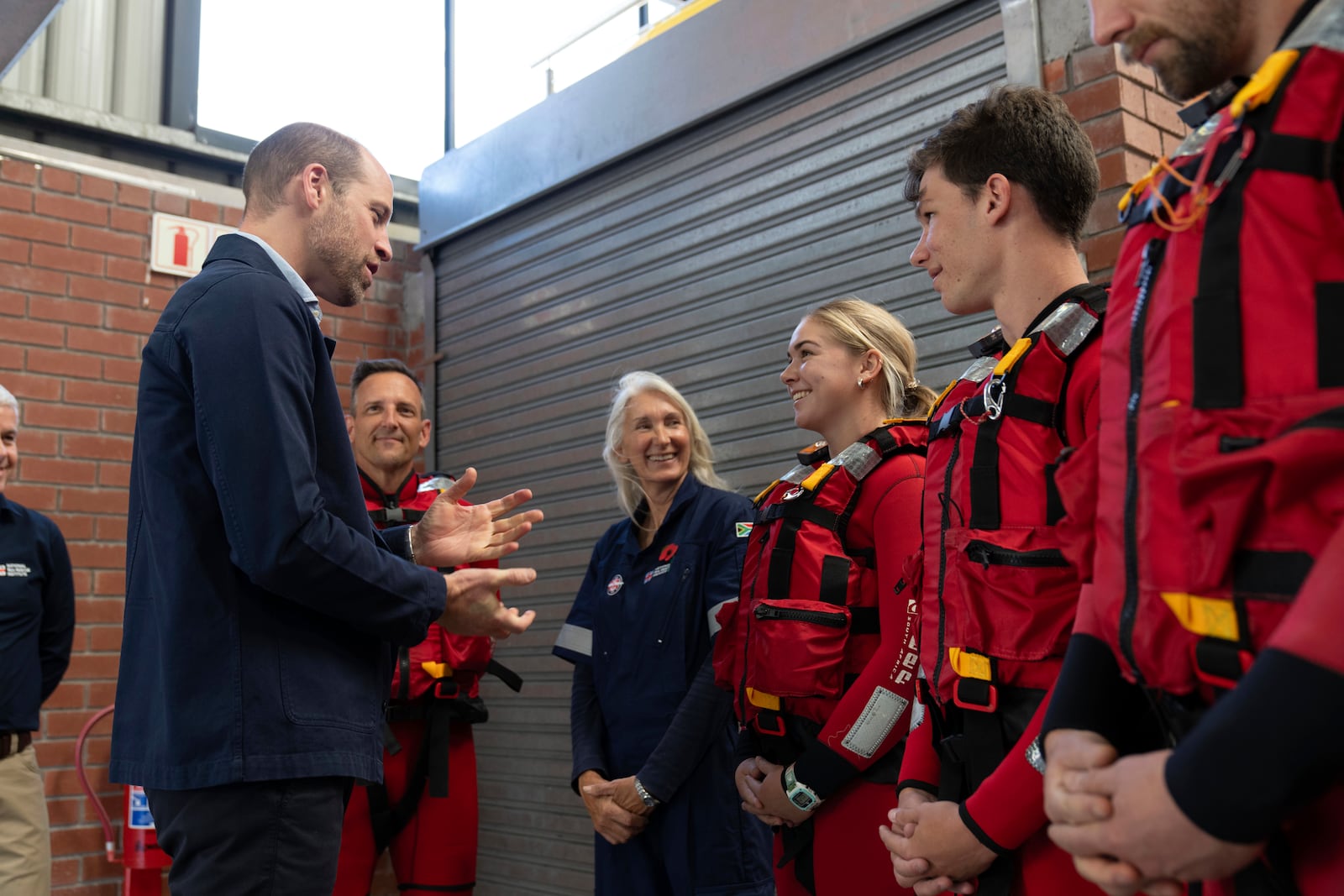 Britain's Prince William meets volunteers of the National Sea Rescue Initiative at Simon's Town harbour in Cape Town, South Africa, Thursday, Nov. 7, 2024. (AP Photo/Jerome Delay, Pool)