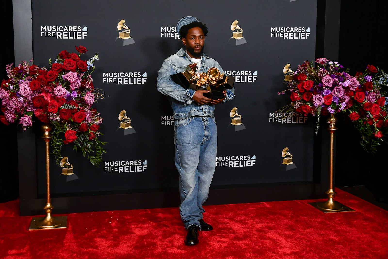 Kendrick Lamar poses in the press room with the award for record of the year, best rap performance, best rap song, best music video and song of the year during the 67th annual Grammy Awards on Sunday, Feb. 2, 2025, in Los Angeles. (Photo by Richard Shotwell/Invision/AP)