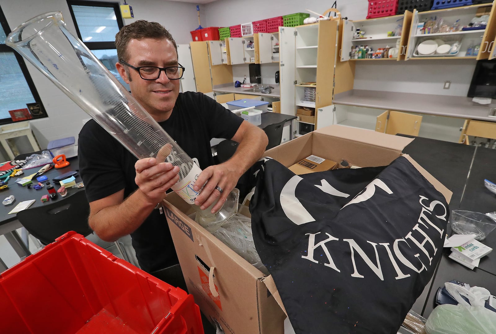 Thomas Jenkins unpacks the supplies for his classroom at the new Greenon School. Jenkins teaches eight grade science/STEM.