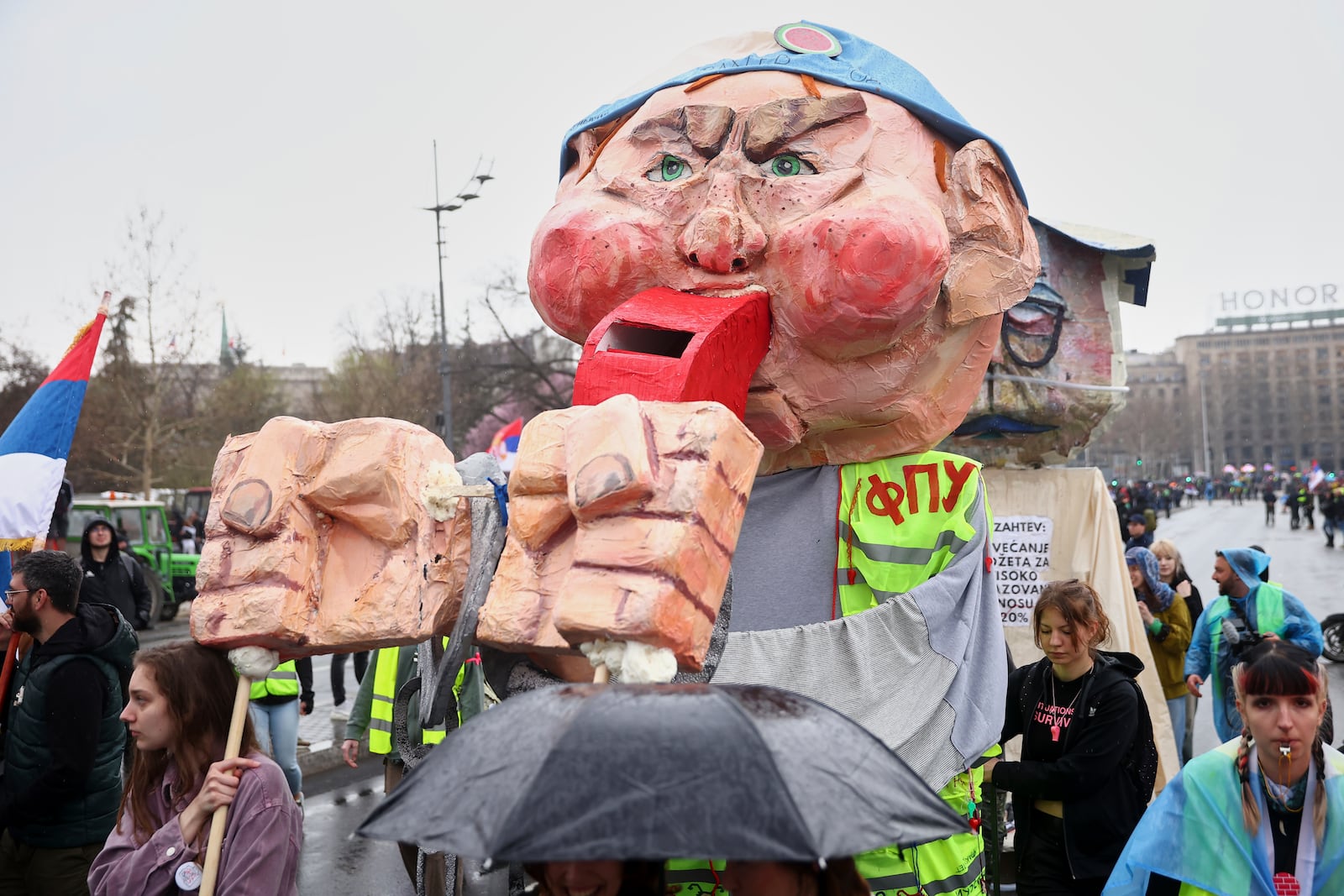 Effigies representing protesters' demands are displayed during a performance at a major rally against populist President Aleksandar Vucic and his government, in downtown Belgrade, Serbia, Saturday, March 15, 2025. (AP Photo/Armin Durgut)