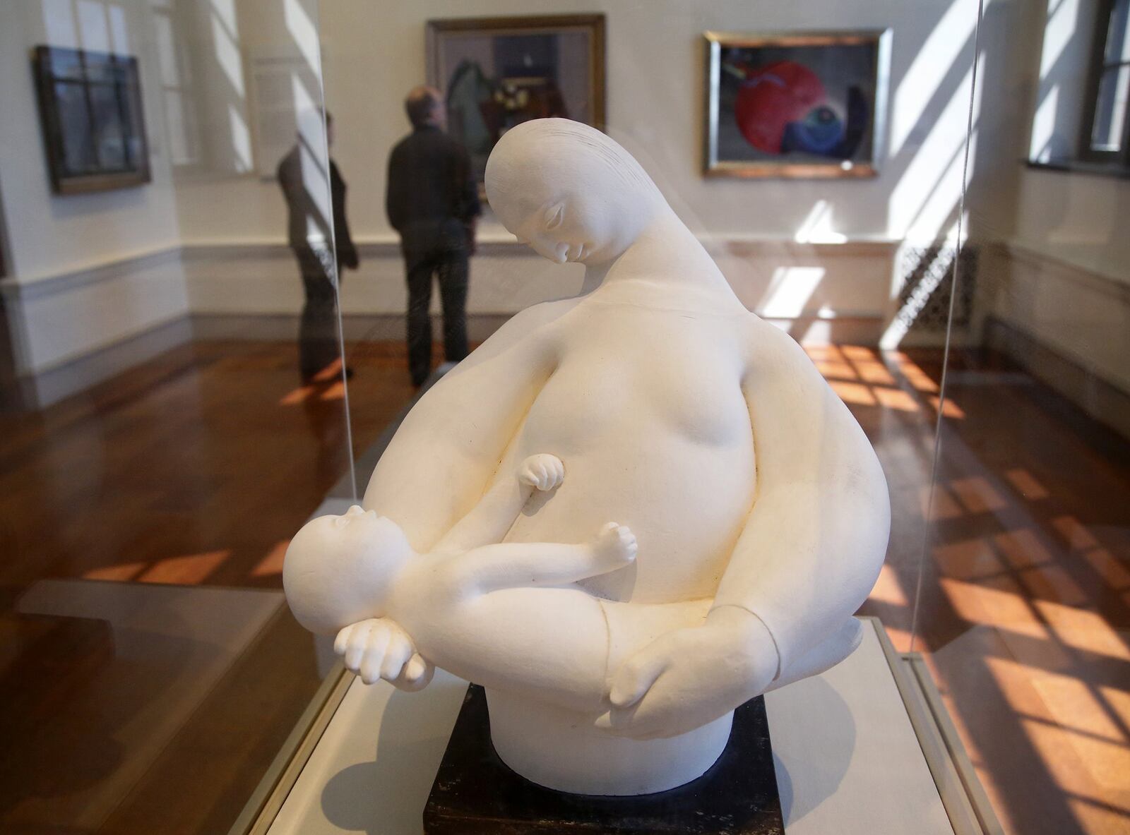 The sculpture, Mother Cradling Baby by Hugo Robus, is made of plaster and created in 1957. The simplified forms of mother and child suggests if was influenced by modernist art movements according to the object label and “the rhythmic, fluid forms of the figures amplify the tenderness of their embrace…” LISA POWELL / STAFF