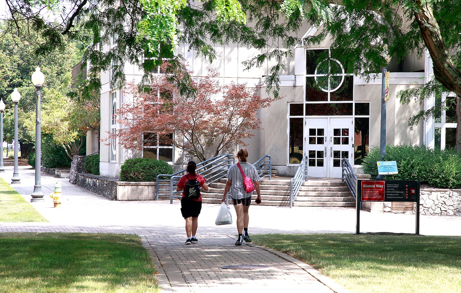 Two students walk across the campus of Wittenberg University Thursday, August 1, 2024. BILL LACKEY/STAFF