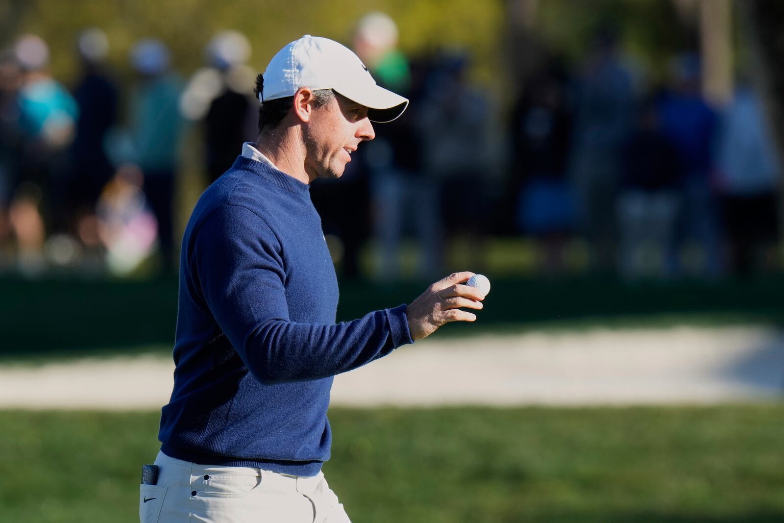 Rory McIlroy, right, of Northern Ireland, reacts after making a putt on the 16th hole during a playoff round of The Players Championship golf tournament Monday, March 17, 2025, in Ponte Vedra Beach, Fla. (AP Photo/Chris O'Meara)