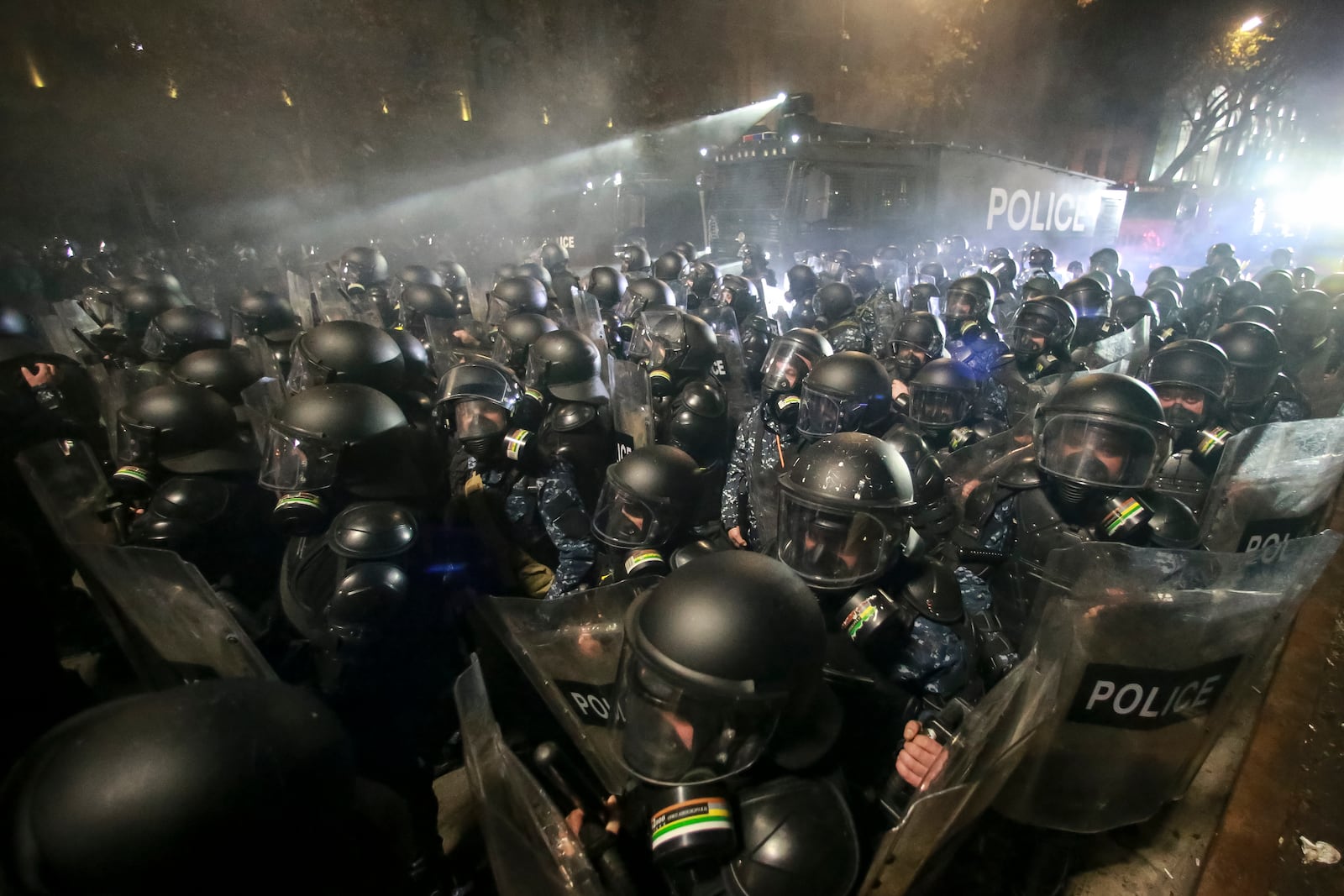 Police use a water cannon on protesters during a rally outside the parliament to protest the governments' decision to suspend negotiations on joining the European Union for four years in Tbilisi, Georgia, early Saturday, Nov. 30, 2024. (AP Photo/Zurab Tsertsvadze)