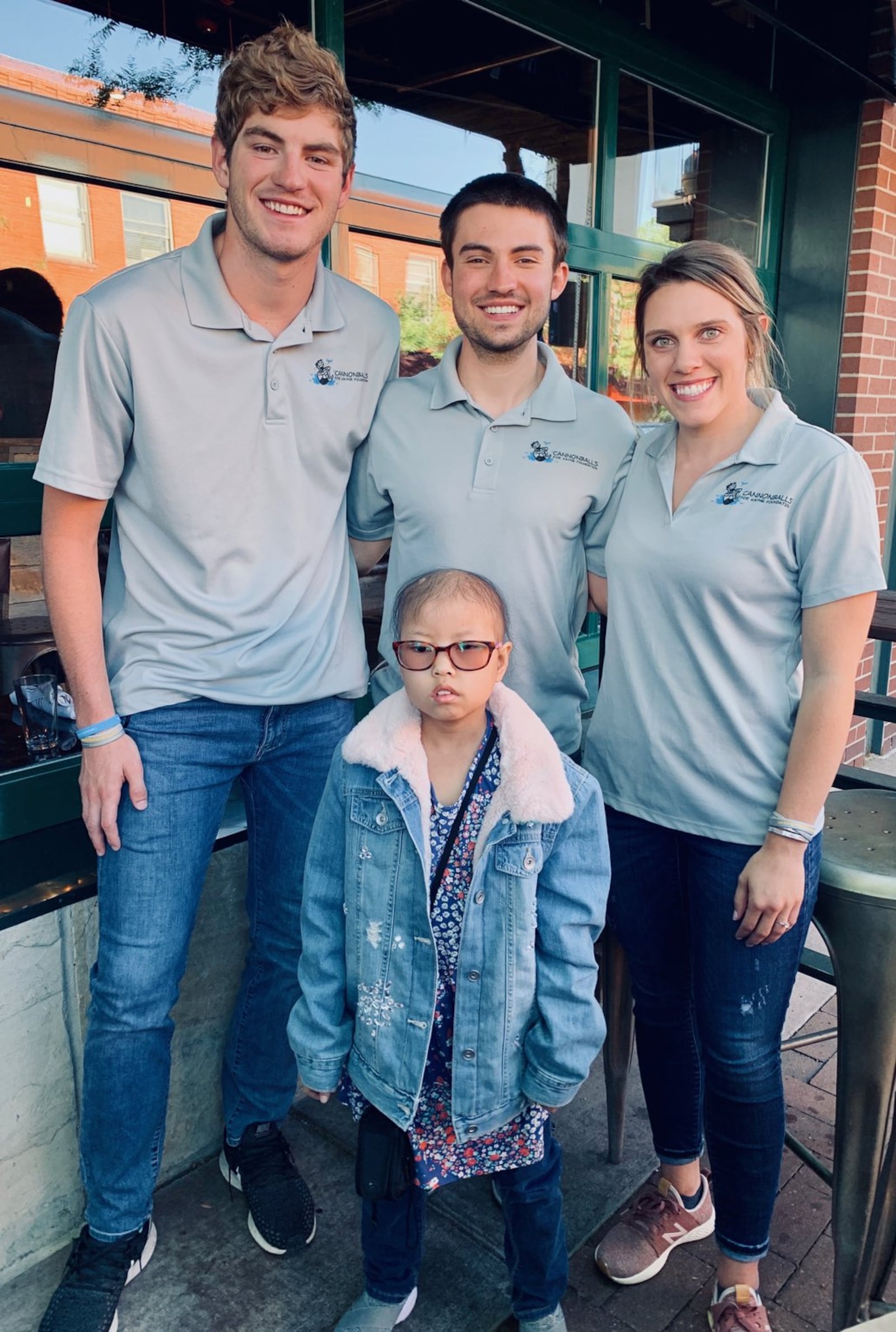 Keagan Finley, Zach Major and Kendra Crew, oof Cannonballs Across America, pose for a photo with Daisy Walsh, who is battling brain cancer, in Arvada, Colo., on June 1. Submitted photo