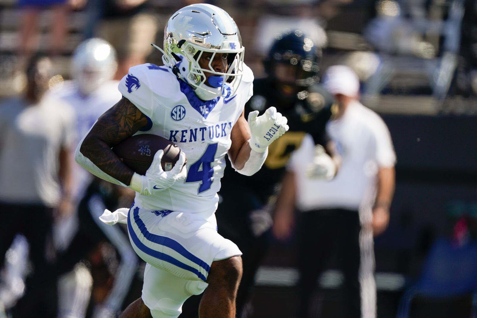 Kentucky running back JuTahn McClain (4) runs for a 36-yard touchdown against against Vanderbilt in the first half of an NCAA college football game Saturday, Sept. 23, 2023, in Nashville, Tenn. (AP Photo/George Walker IV)