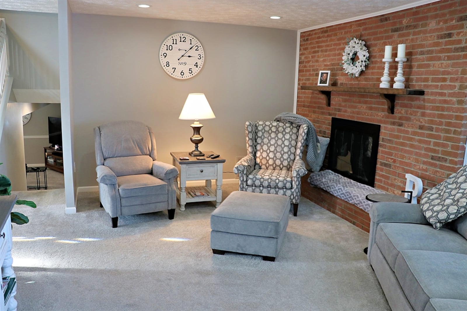 Brick wood-burning fireplace can be enjoyed from the great room that is open to the breakfast area.