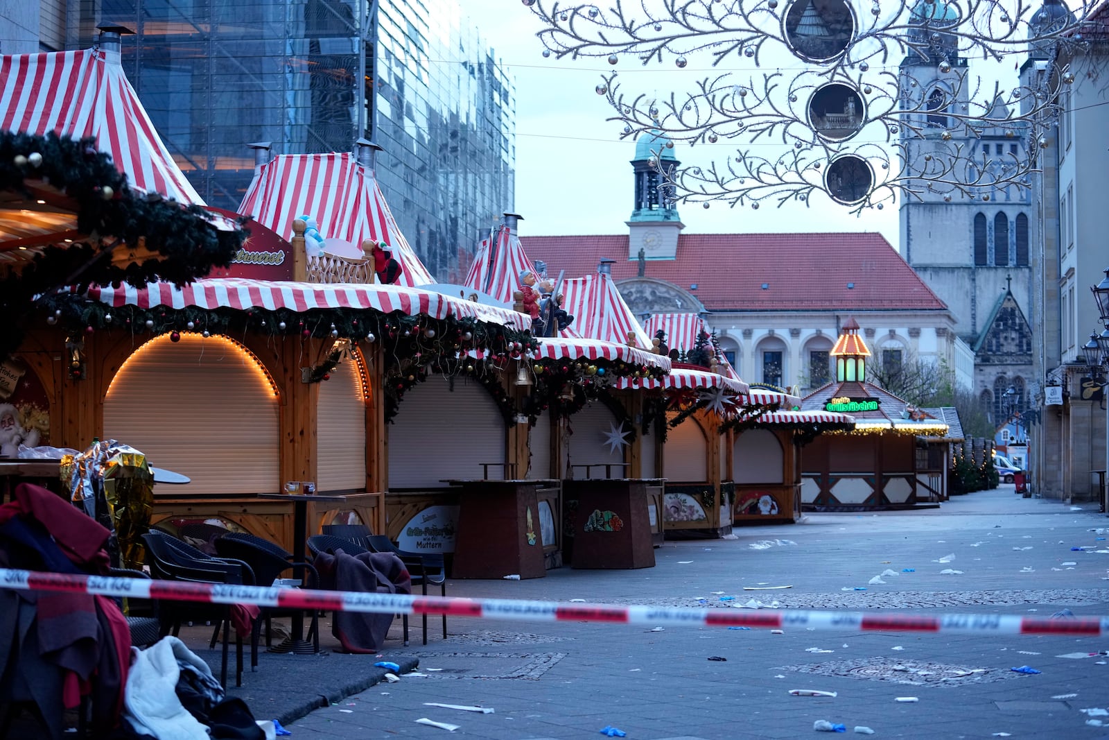 Police tape cordons-off a Christmas Market, where a car drove into a crowd on Friday evening, in Magdeburg, Germany, Saturday, Dec. 21, 2024. (AP Photo/Ebrahim Noroozi)