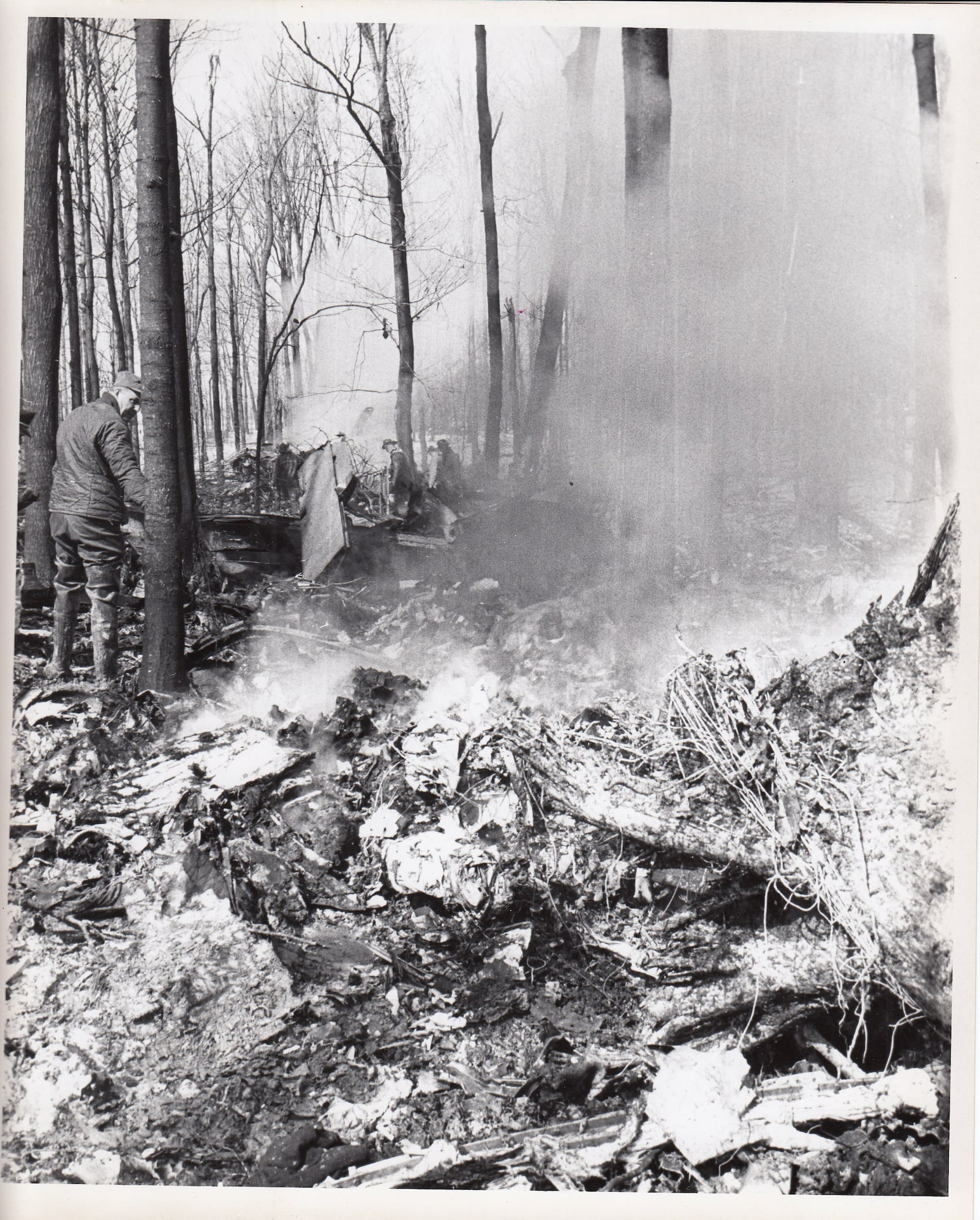 Investigators look over the plane crash debris in rural Champaign County on March 9, 1967. Archive photos