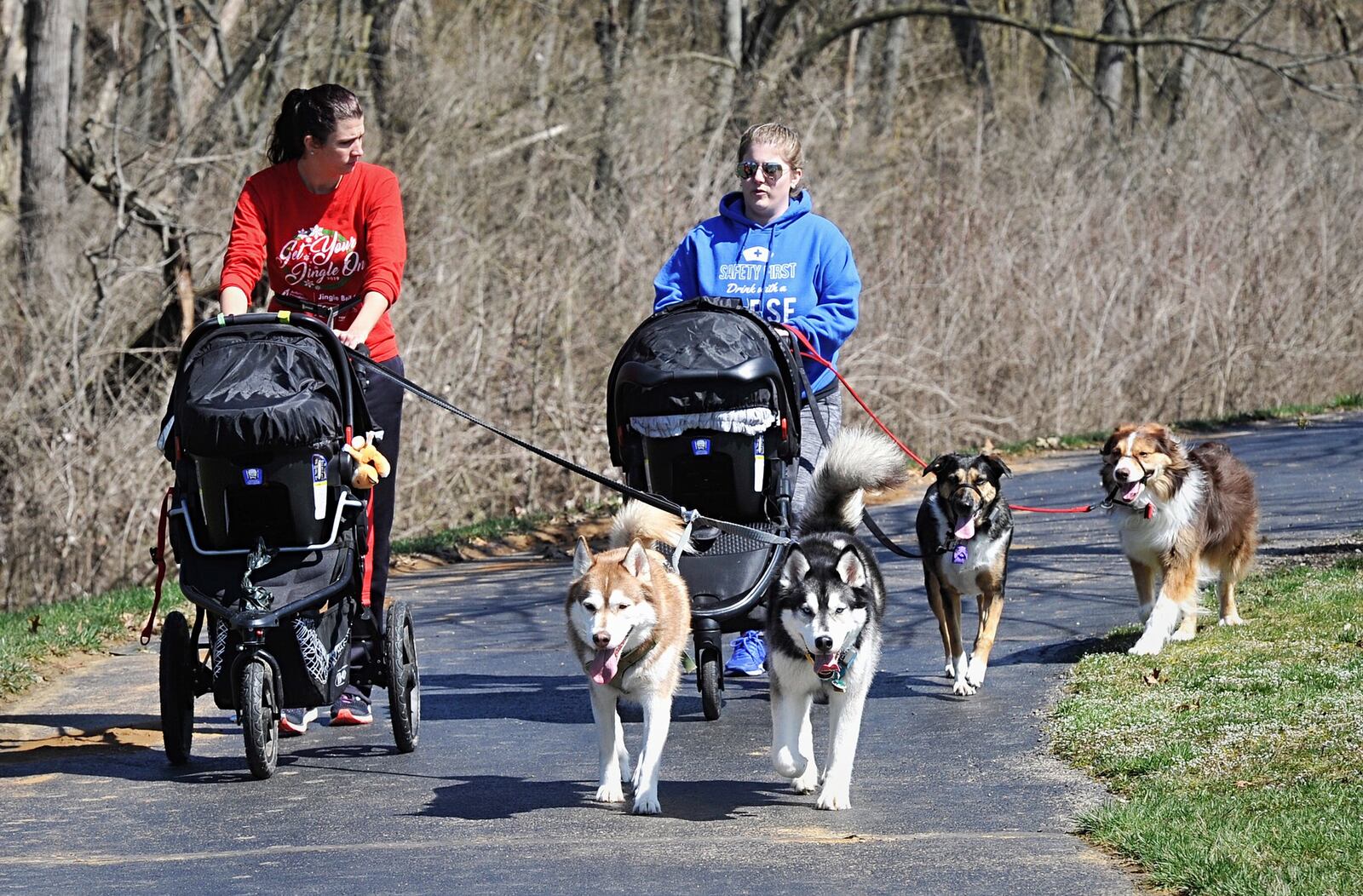 April Jeffery, left and Kalie Baver, take time to enjoy the beautiful weather on Wednesday to walk their dogs and kids at Delco Park. Enjoying fresh weather with friends (with social distance) … maybe even walking a neighbor’s dog are ways to be kind. MARSHALL GORBYSTAFF