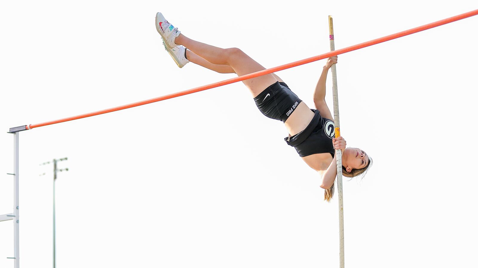 Greenon High School's Tru Buddenburg competes in the pole vault at the Clark County Championships on Tuesday evening at Greenon High School. Buddenburg set a new meet record with a leap of 11 feet, 8 inches. Michael Cooper/CONTRIBUTED