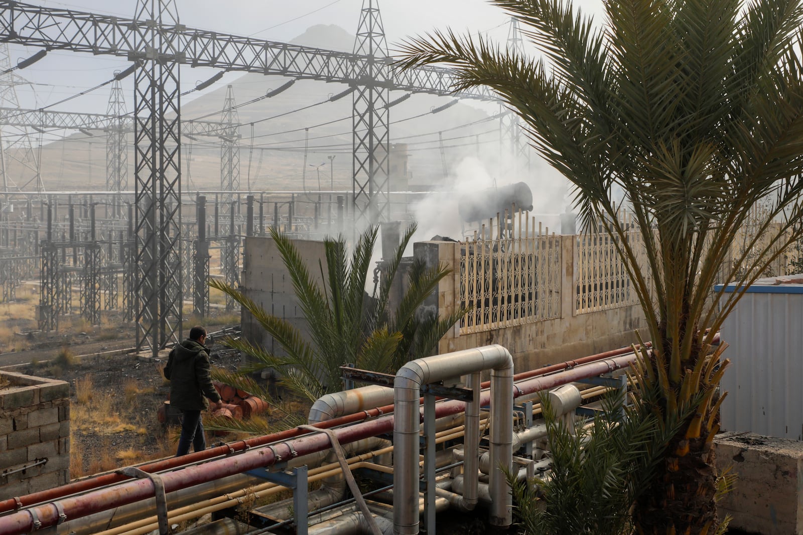 Smoke rises from the scene of an Israeli airstrike on the Haziz power station in southern Sanaa, Yemen, Thursday, Dec. 19, 2024. A series of intense Israeli airstrikes rocked Yemen's rebel-held capital and a port city early Thursday, killing at least nine people, according to officials. The strikes followed a Houthi missile attack on central Israel. (AP Photo/Osamah Abdulrahman)