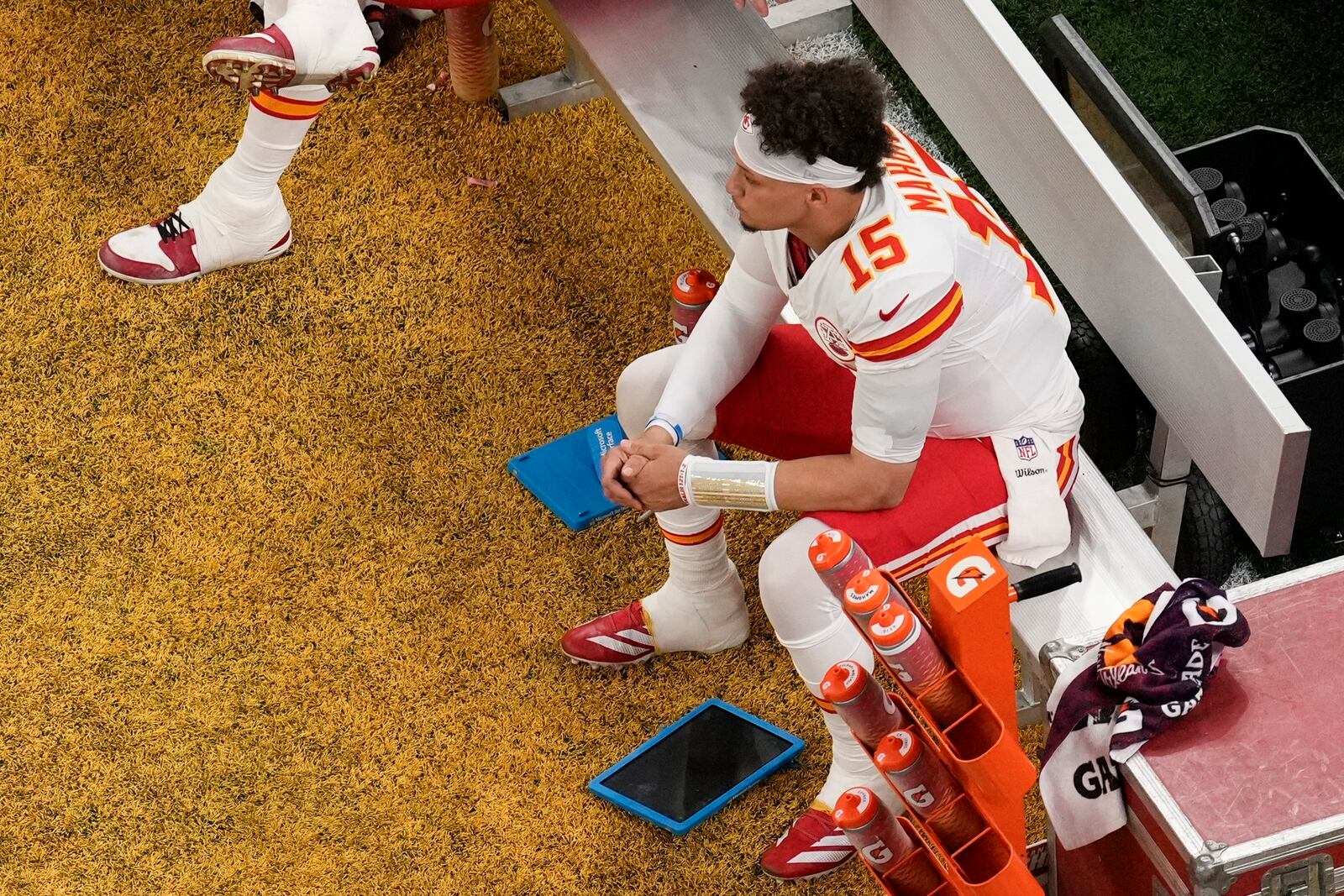 Kansas City Chiefs quarterback Patrick Mahomes (15) sits on the bench during the first half of the NFL Super Bowl 59 football game against the Philadelphia Eagles, Sunday, Feb. 9, 2025, in New Orleans. (AP Photo/David J. Phillip)