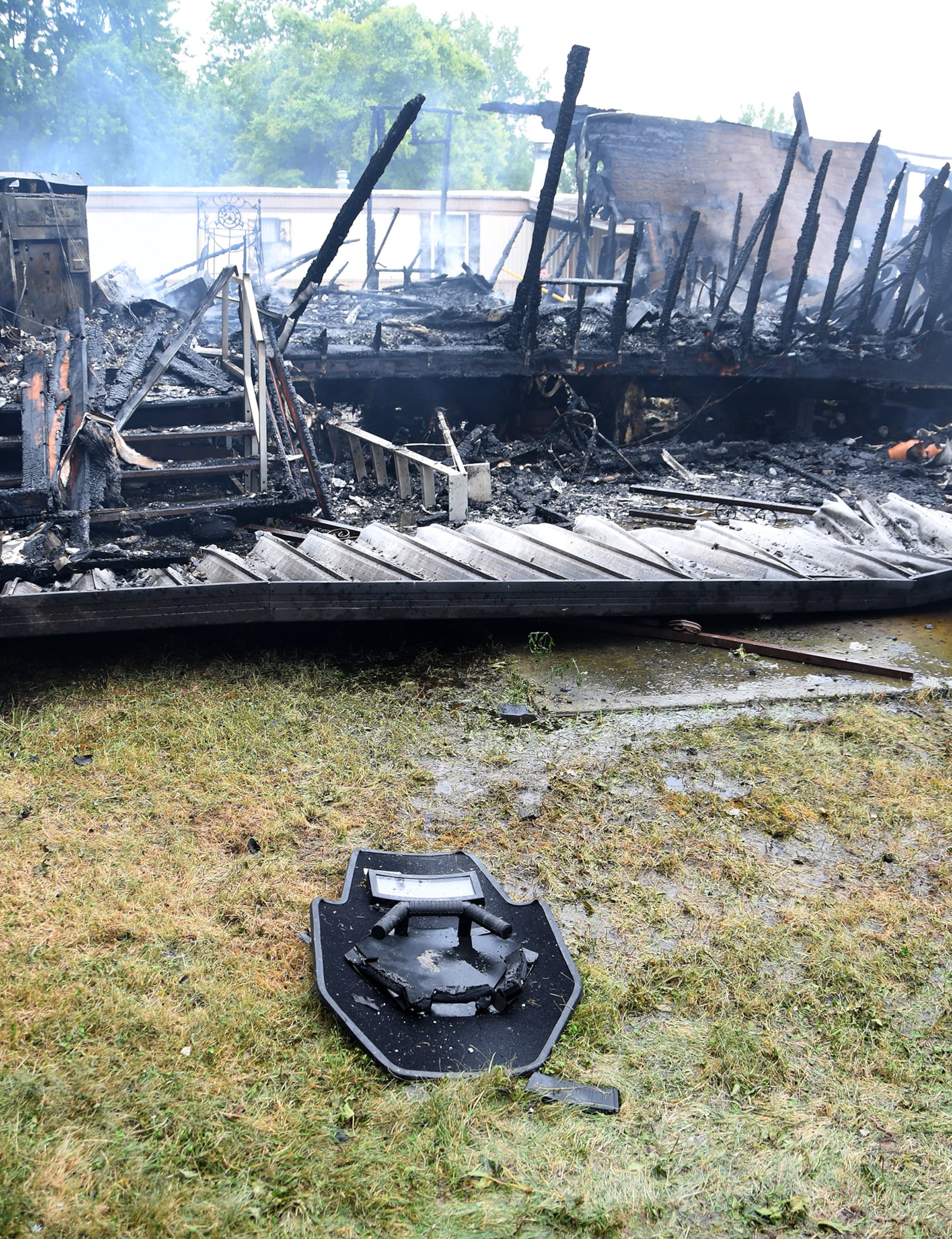 A ballistic shield is shown on the ground outside the remains of a mobile home in Harmony Estates Mobile Home Park in Clark County on July 24, 2022. Officials said a mother was killed by her son, who then killed a sheriff's deputy. CONTRIBUTED