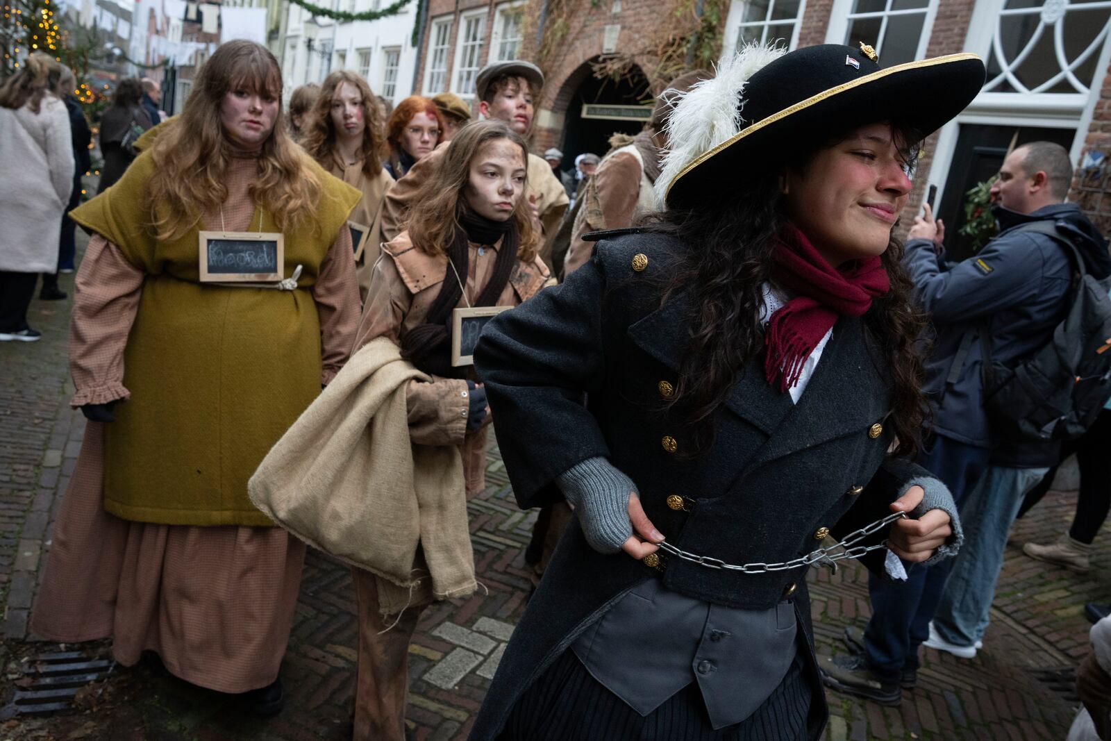 People in costumes from Charles Dickens' 19th-century English era take part in a Dickens Festival, in Deventer, Netherlands, Saturday, Dec. 14, 2024. (AP Photo/Peter Dejong)