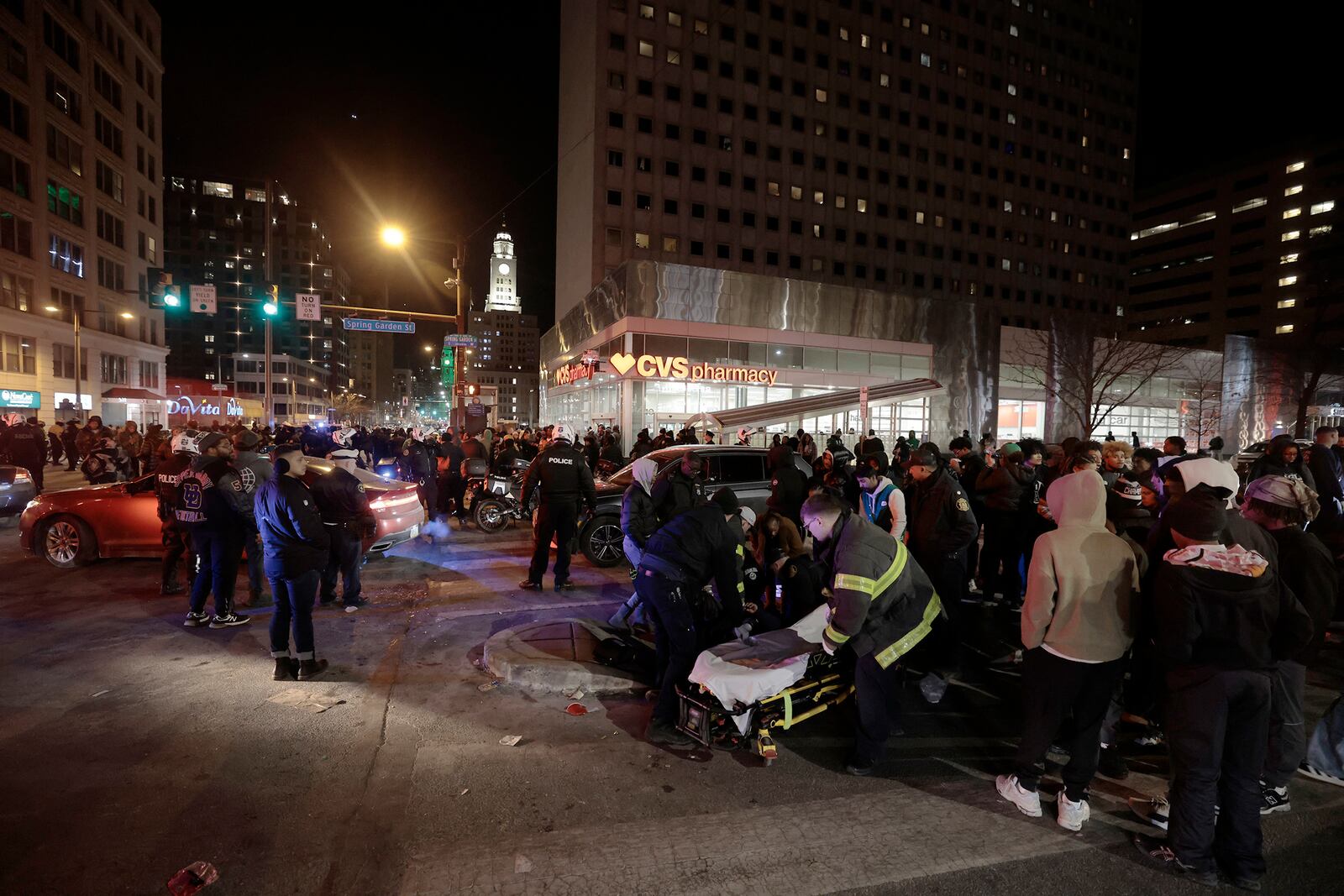 Police and emergency personnel assist multiple people who were struck by a car, at Broad and Spring Garden Street, while celebrating after the Eagles won the Washington Commanders vs. Philadelphia Eagles NFC Championship game in Philadelphia on Sunday, Jan. 26, 2025. ( (Elizabeth Robertson/The Philadelphia Inquirer via AP)