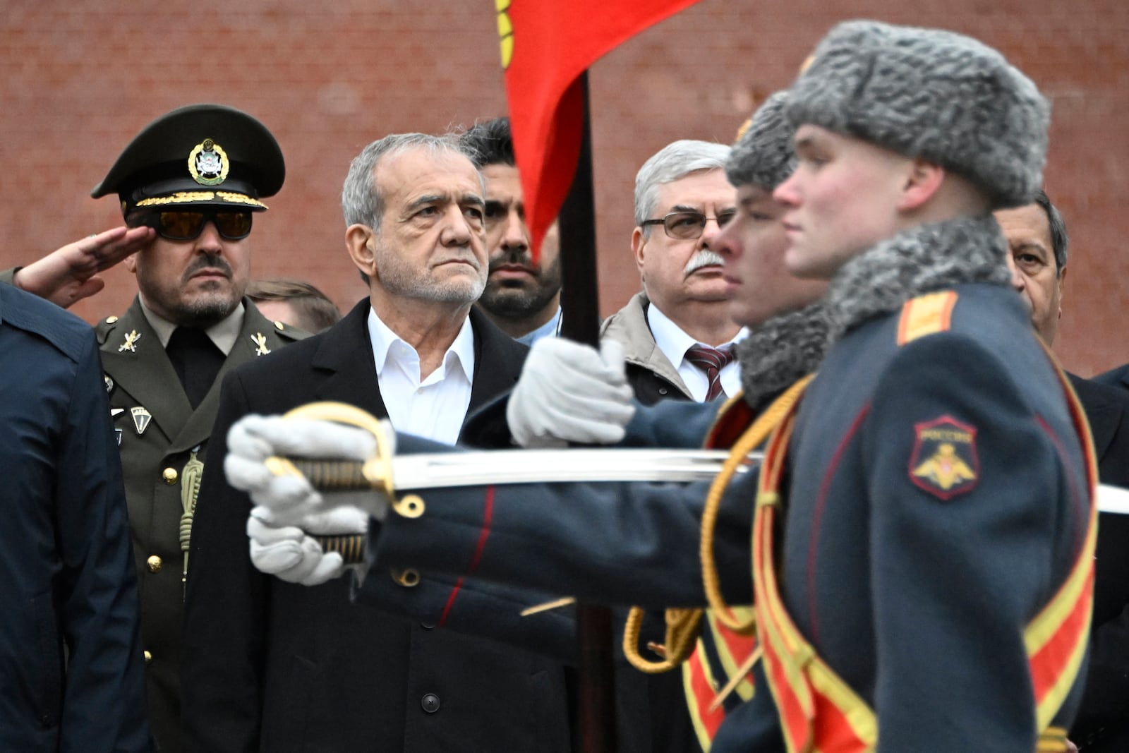 Iranian President Masoud Pezeshkian, centre, attends a laying ceremony at the Unknown Soldier near the Kremlin Wall in Moscow, Russia, Friday, Jan. 17, 2025. (Alexander Nemenov/Pool Photo via AP)