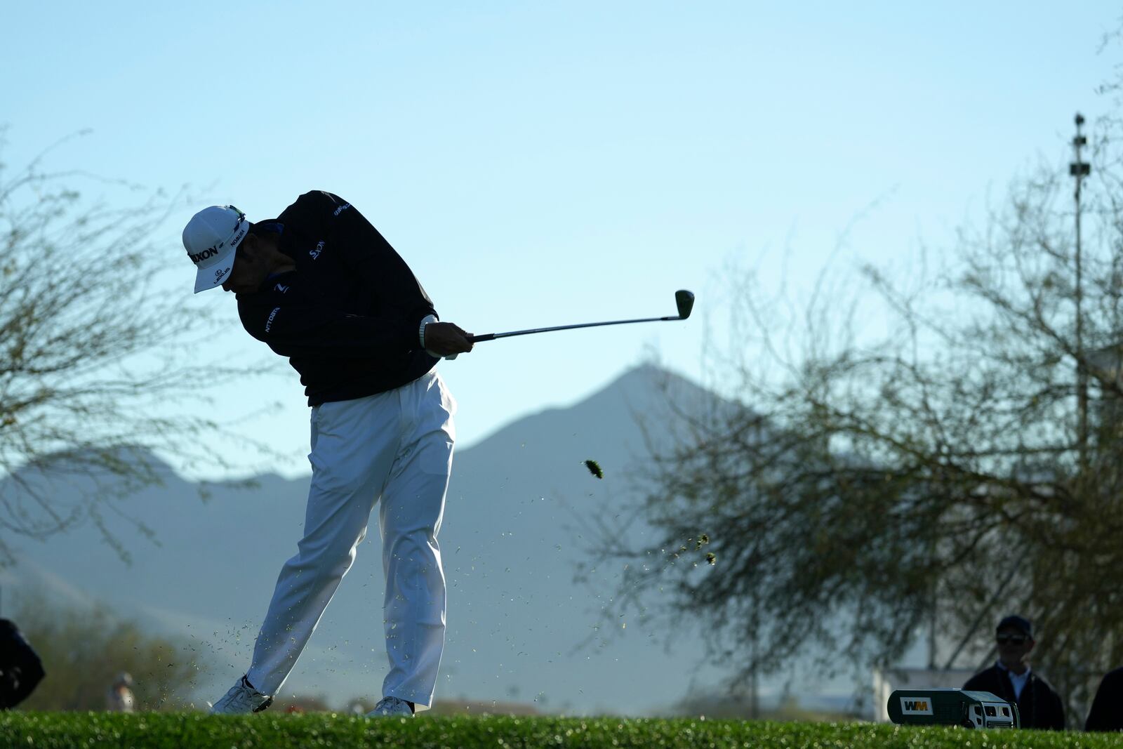 Hideki Matsuyama, of Japan, hits his tee shot at the 12th hole during the first round of the Waste Management Phoenix Open PGA Tour golf tournament at the TPC Scottsdale Thursday, Feb. 6, 2025, in Scottsdale, Ariz. (AP Photo/Ross D. Franklin)