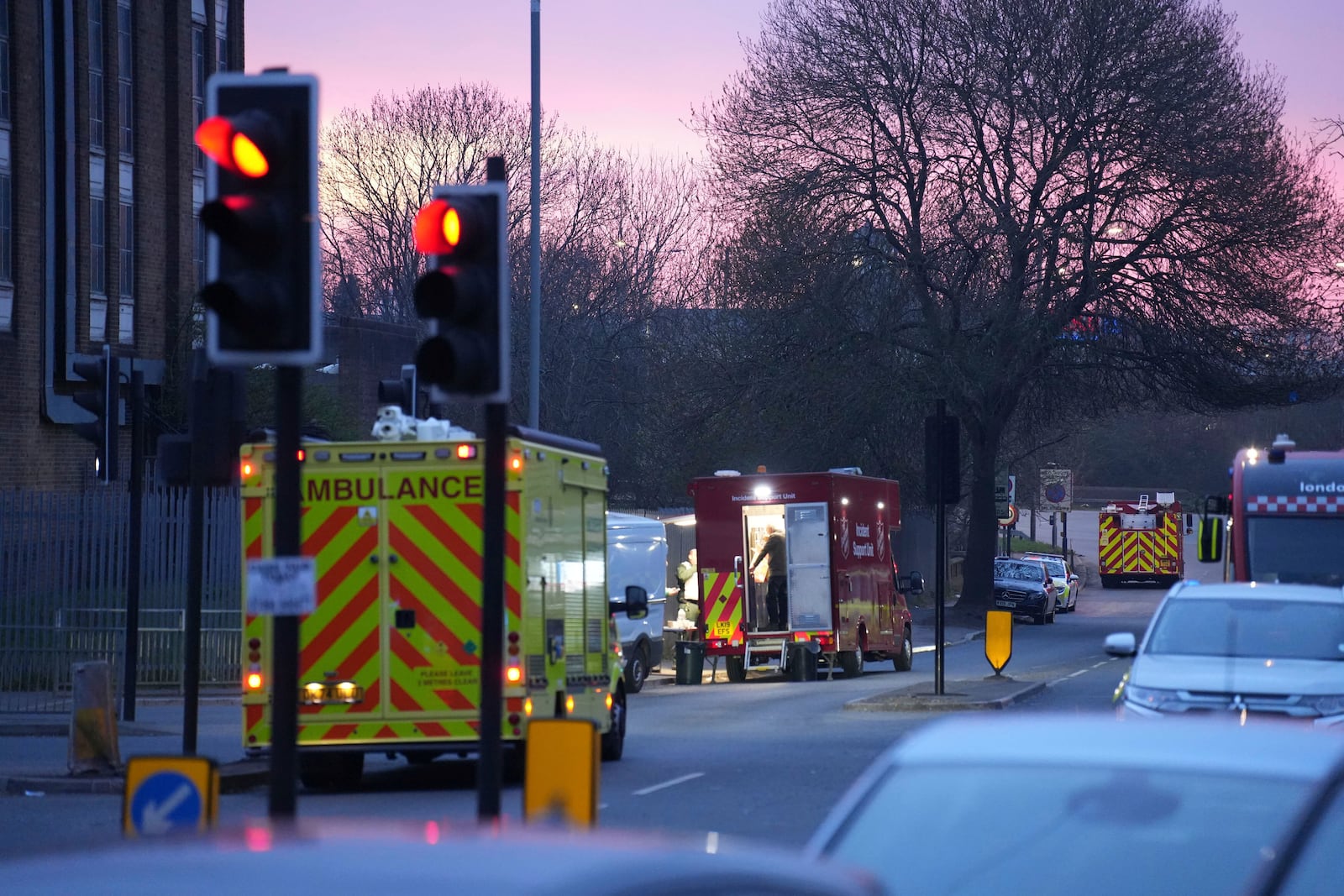 Emergency services are seen at the scene in Roseville Road, west London, Friday, March 21, 2025, near the North Hyde electrical substation, which caught fire Thursday night. (James Weech/PA via AP)