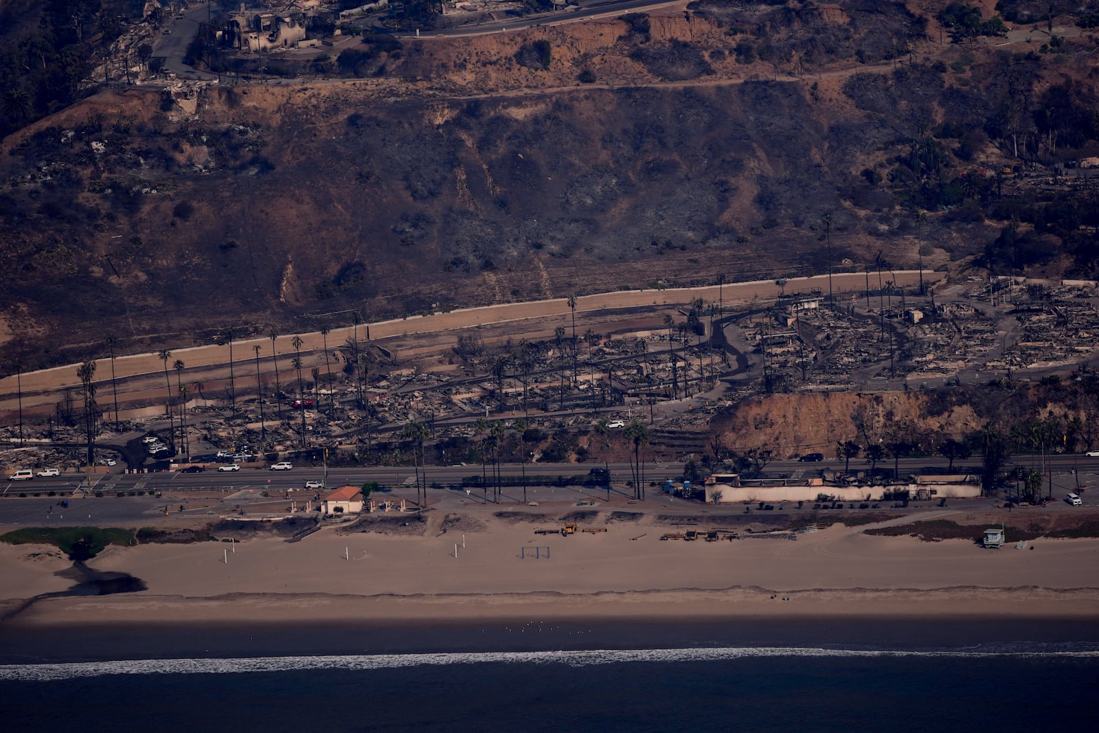 The devastation from the Palisades Fire is seen from the air in the Pacific Palisades neighborhood of Los Angeles, Thursday, Jan. 9, 2025. (AP Photo/Mark J. Terrill)