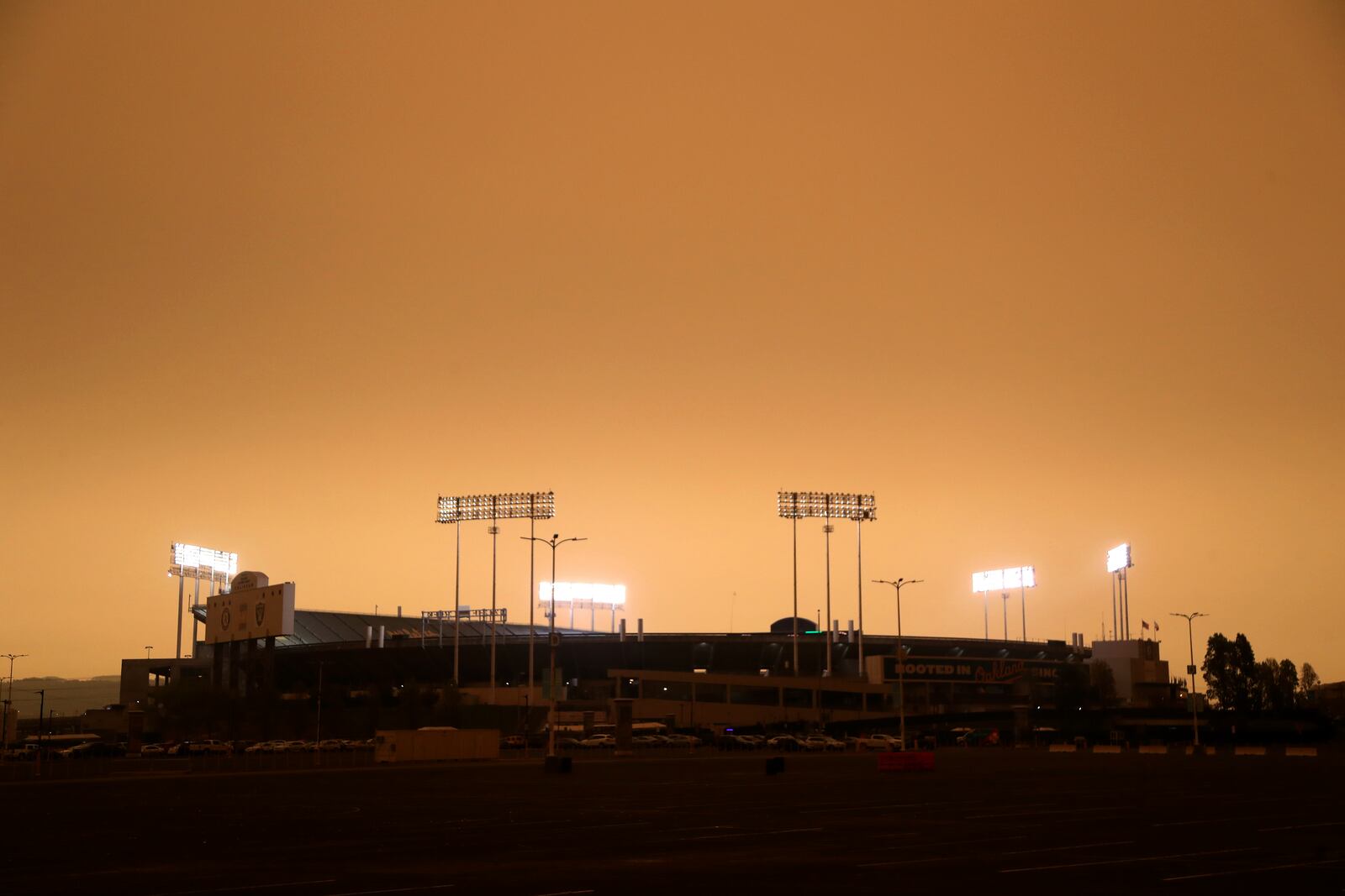 RingCentral Coliseum stands under skies darkened by wildfire smoke before the Oakland Athletics' baseball game against the Houston Astros in Oakland, Calif., Wednesday, Sept. 9, 2020. (AP Photo/Jed Jacobsohn)