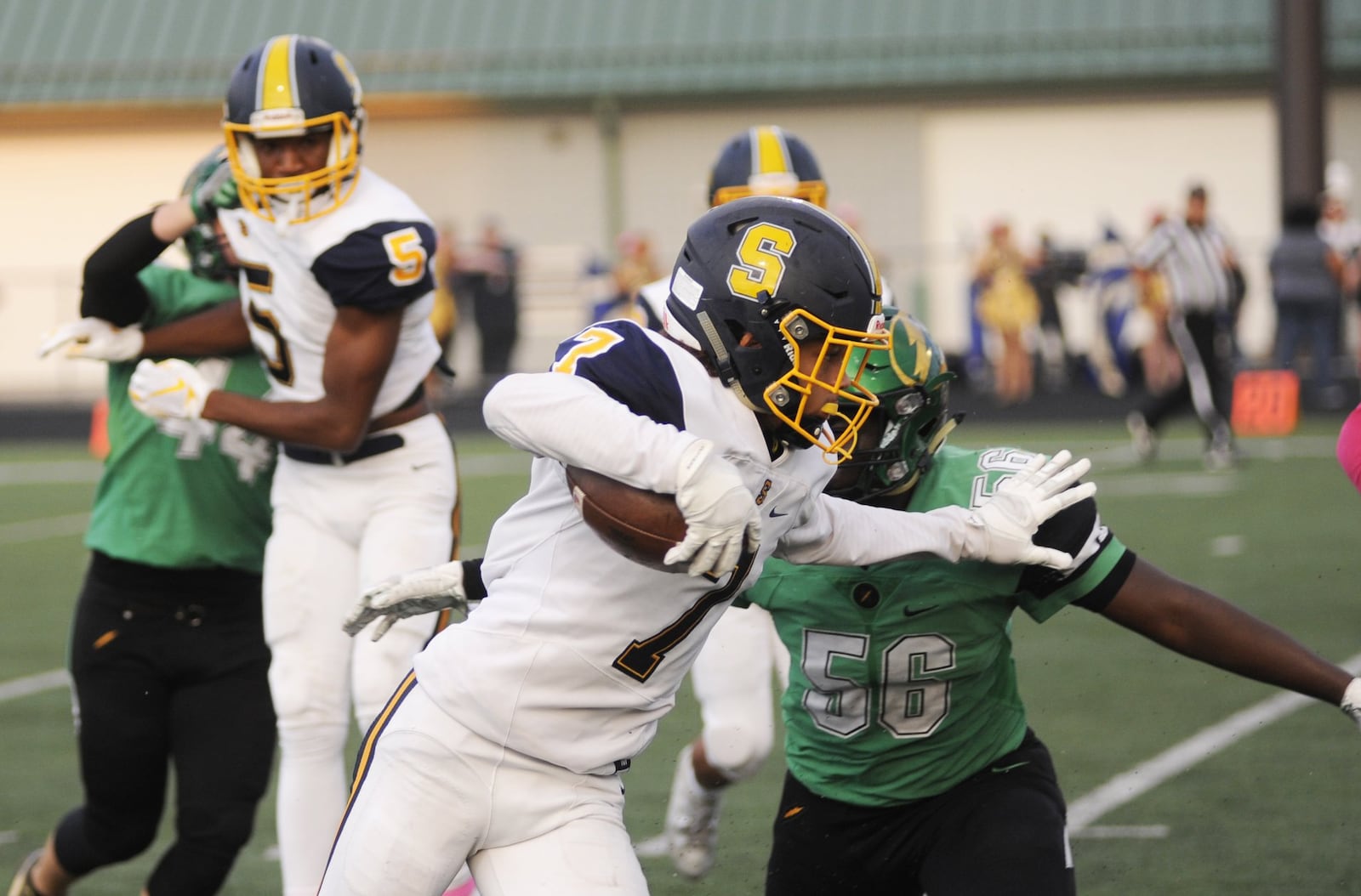 Springfield’s Michael Brown-Stephens (with ball) takes on Northmont’s Phillip Quansah. Northmont defeated visiting Springfield 25-7 in a Week 7 high school football game on Friday, Oct. 5, 2018. MARC PENDLETON / STAFF