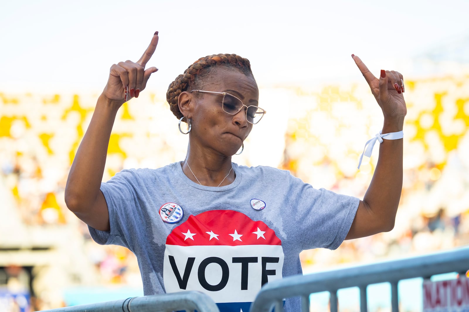 An attendee dances during a rally for Democratic presidential nominee Vice President Kamala Harris on Friday, Oct. 25, 2024, in Houston. (AP Photo/Annie Mulligan)