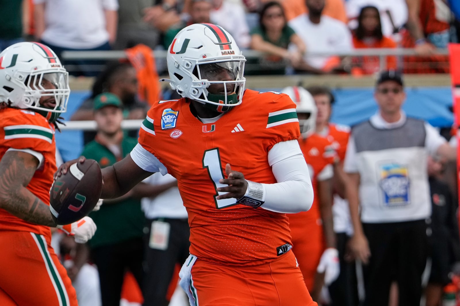 Miami quarterback Cam Ward (1) throws a pass during the first half of the Pop Tarts Bowl NCAA college football game against Iowa State, Saturday, Dec. 28, 2024, in Orlando, Fla. (AP Photo/John Raoux)