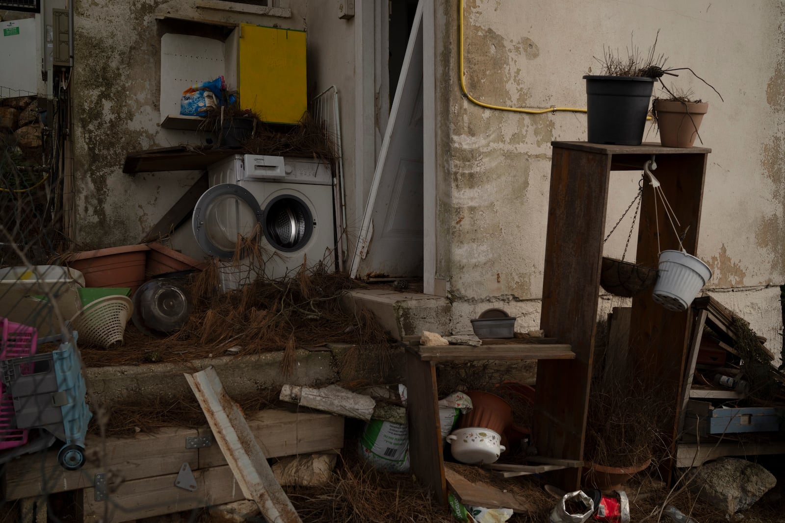 A washing machine stands outside of a damaged house in the Kibbutz Manara, which is located near to the border with Lebanon, in the northern Israel, Thursday, Nov. 28, 2024. (AP Photo/Leo Correa)