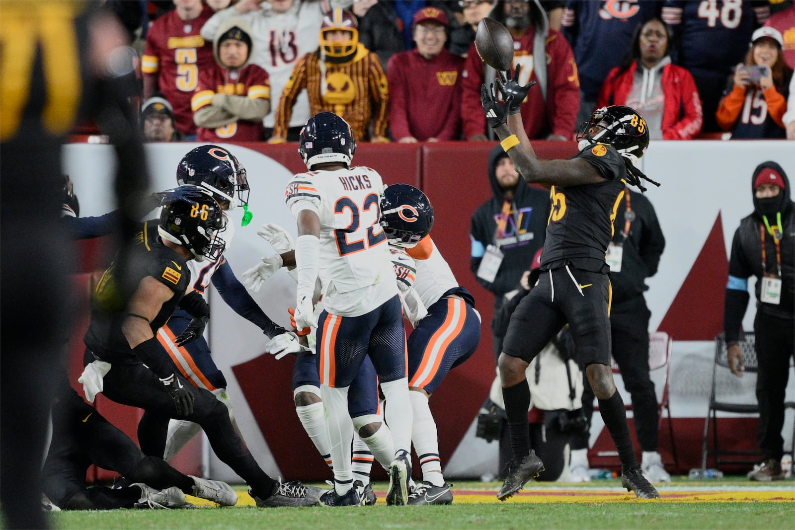 Washington Commanders wide receiver Noah Brown (85) catches a 52-yard touchdown pass in the end zone as time expires to give the Commanders an 18-15 win over the Chicago Bears in an NFL football game Sunday, Oct. 27, 2024, in Landover, Md. (AP Photo/Nick Wass)