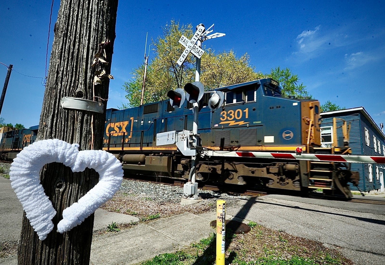 A broken heart memorial marks the railroad crossing at West Walnut Street in Tipp City, where Cynthia Steele, 47, was struck and killed by a CSX train April 8, 2024. MARSHALL GORBY\STAFF