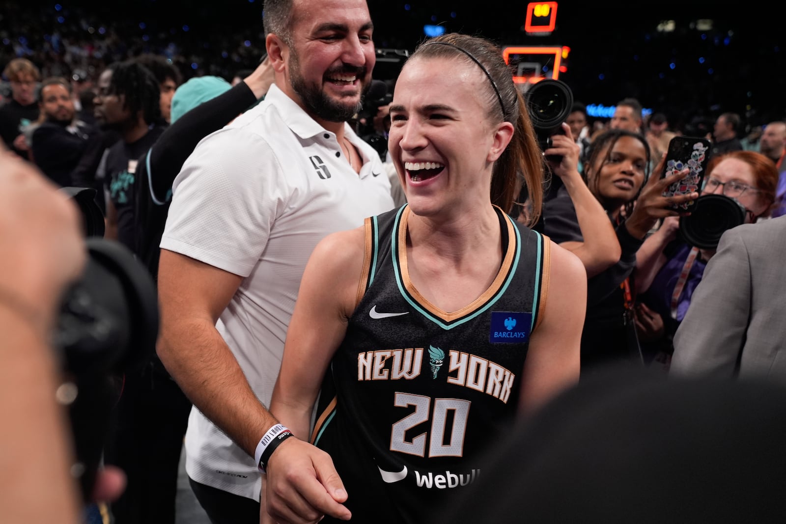 New York Liberty guard Sabrina Ionescu (20) celebrates after the Liberty defeated the Minnesota Lynx in Game 5 of the WNBA basketball final series to win the WNBA championship, Sunday, Oct. 20, 2024, in New York. (AP Photo/Pamela Smith)