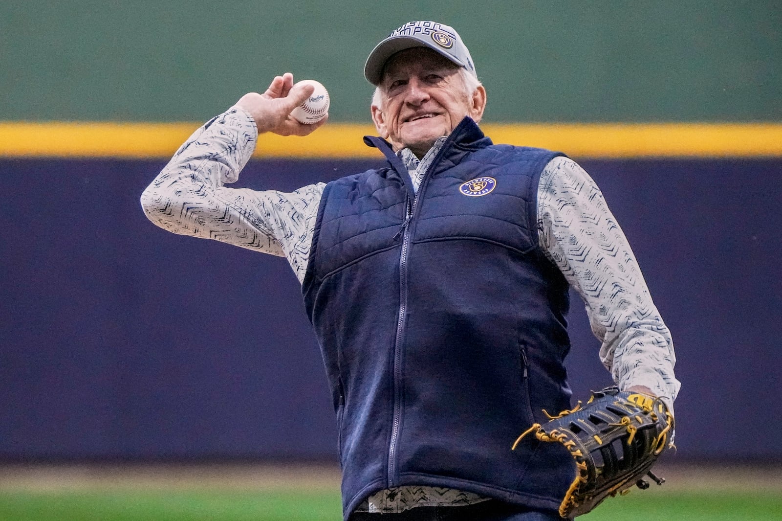 FILE - Bob Uecker throws the ceremonial first pitch before Game 1 of the National League wildcard baseball game between the Milwaukee Brewers and the Arizona Diamondbacks Tuesday, Oct. 3, 2023, in Milwaukee. (AP Photo/Morry Gash)