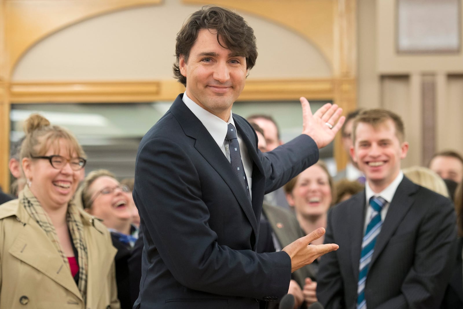 FILE - Liberal Leader Justin Trudeau gestures for media to leave so he can begin his first caucus meeting as leader on April 17, 2013, in Ottawa. (Adrian Wyld/The Canadian Press via AP, File)