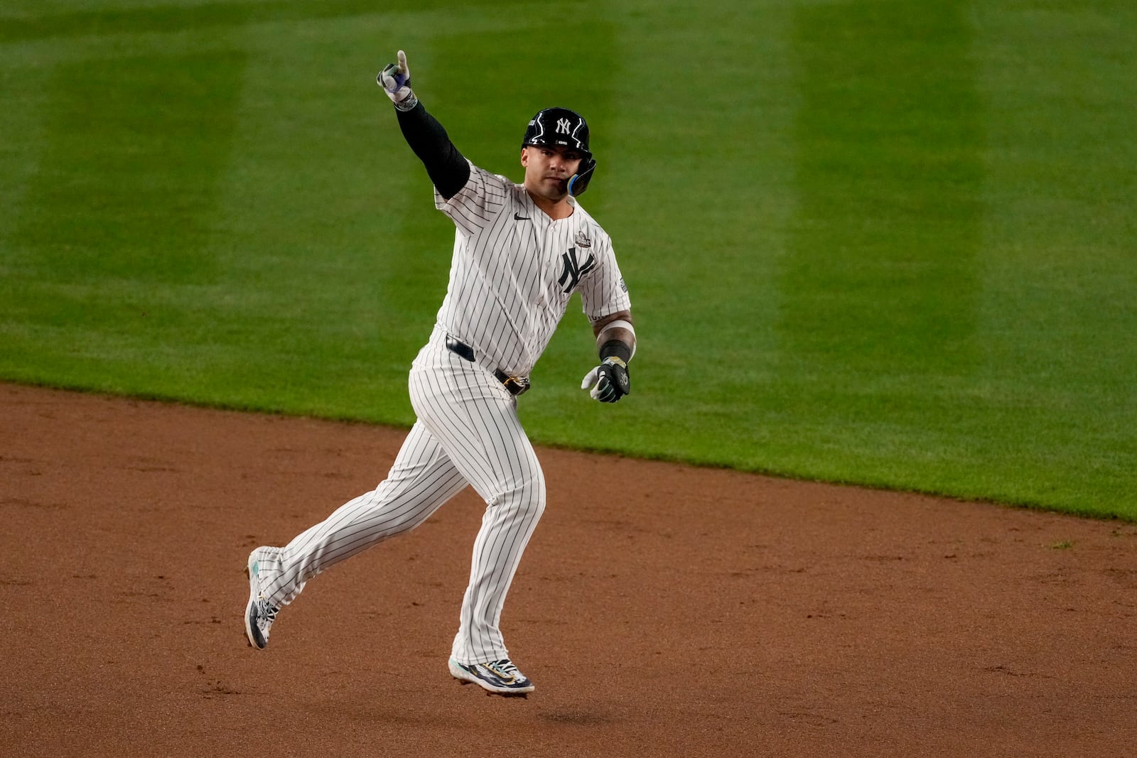 FILE - New York Yankees' Gleyber Torres celebrates a three-run home run against the Los Angeles Dodgers during the eighth inning in Game 4 of the baseball World Series, Tuesday, Oct. 29, 2024, in New York. (AP Photo/Frank Franklin II, File)