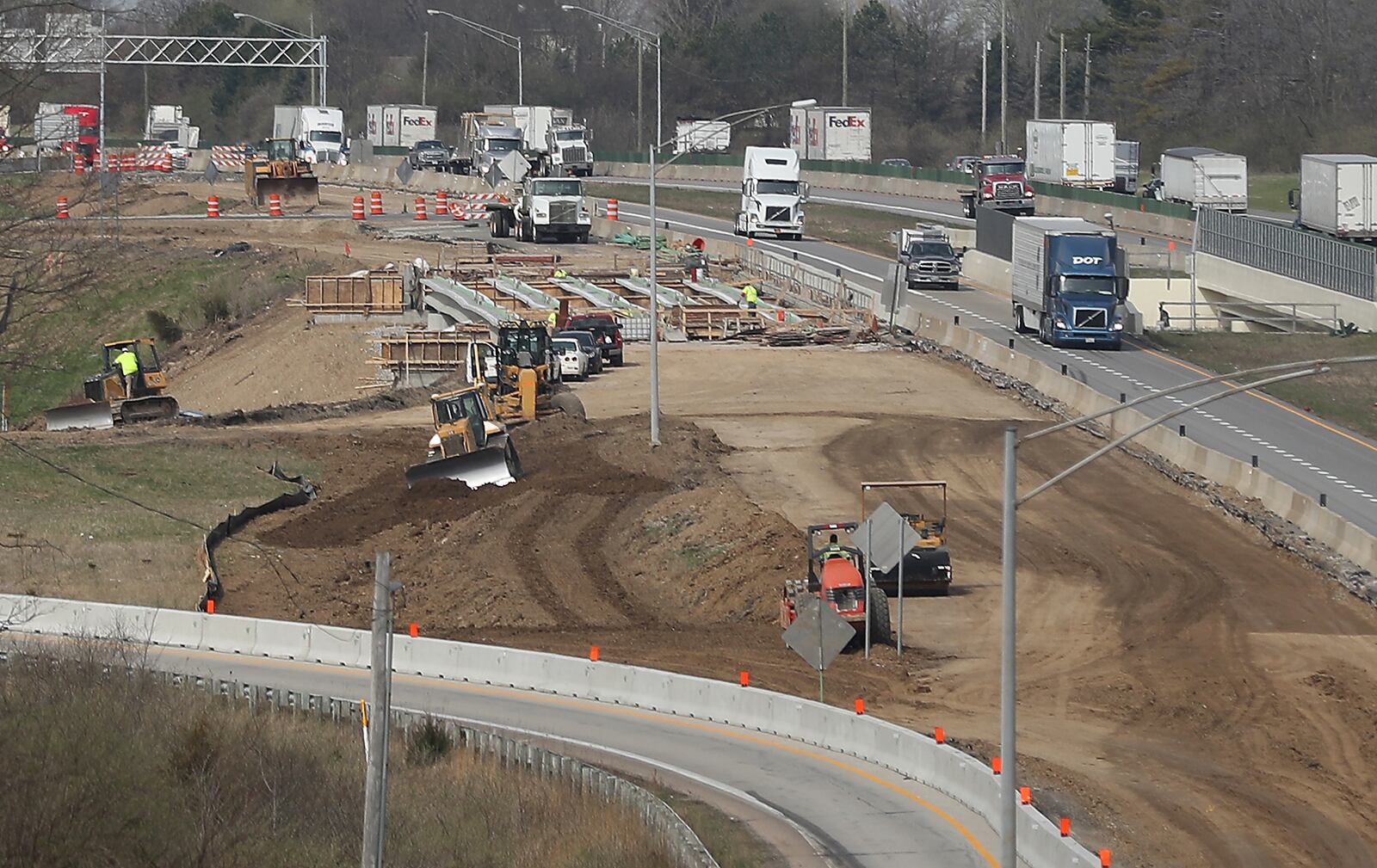 Construction continues on the Interstate 70 overpass over US 68 Tuesday. The overpass is part of ODOT's I-70 lane addition project. BILL LACKEY/STAFF