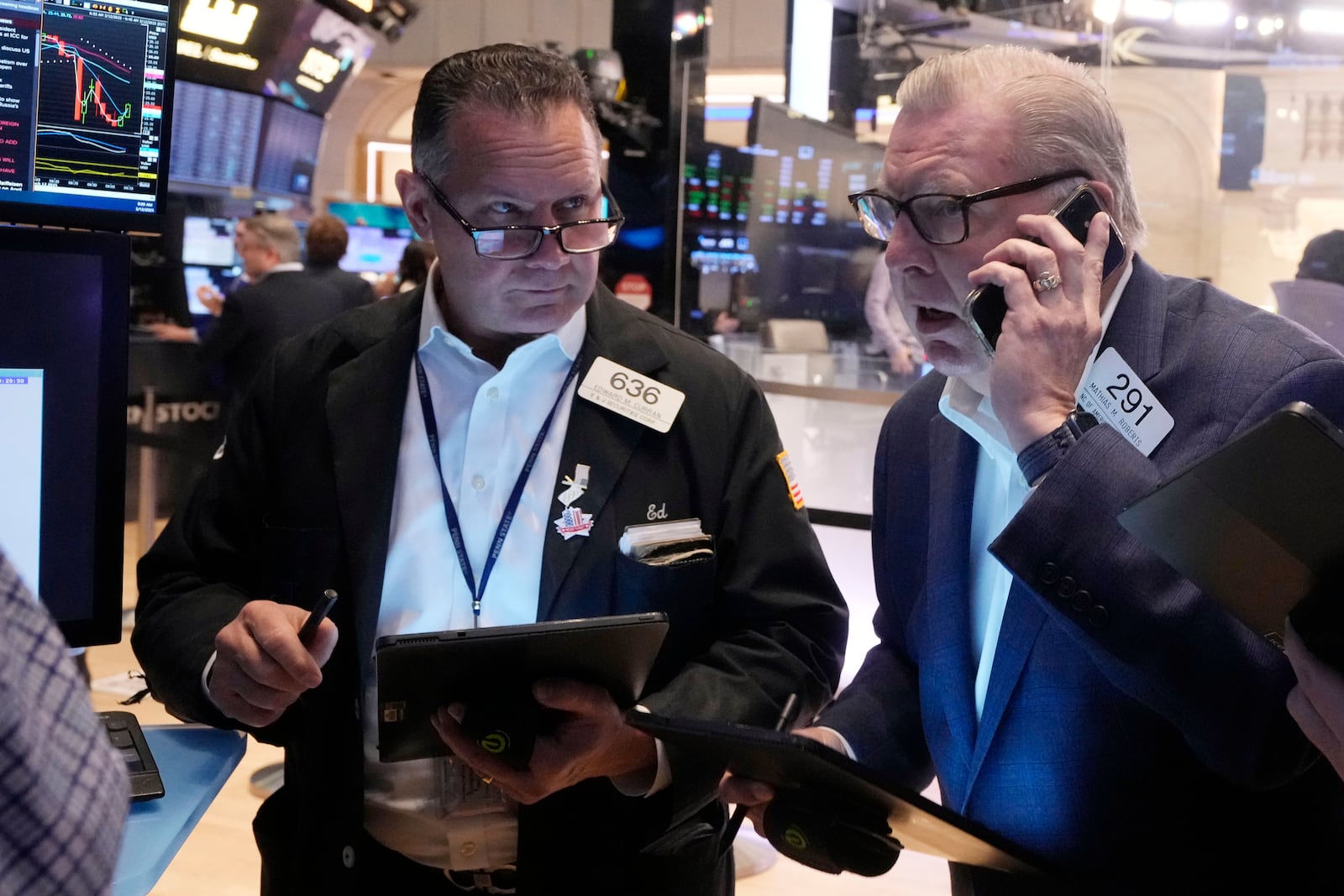 Traders work on the floor of the New York Stock Exchange, Wednesday, March 12, 2025. (AP Photo/Richard Drew)