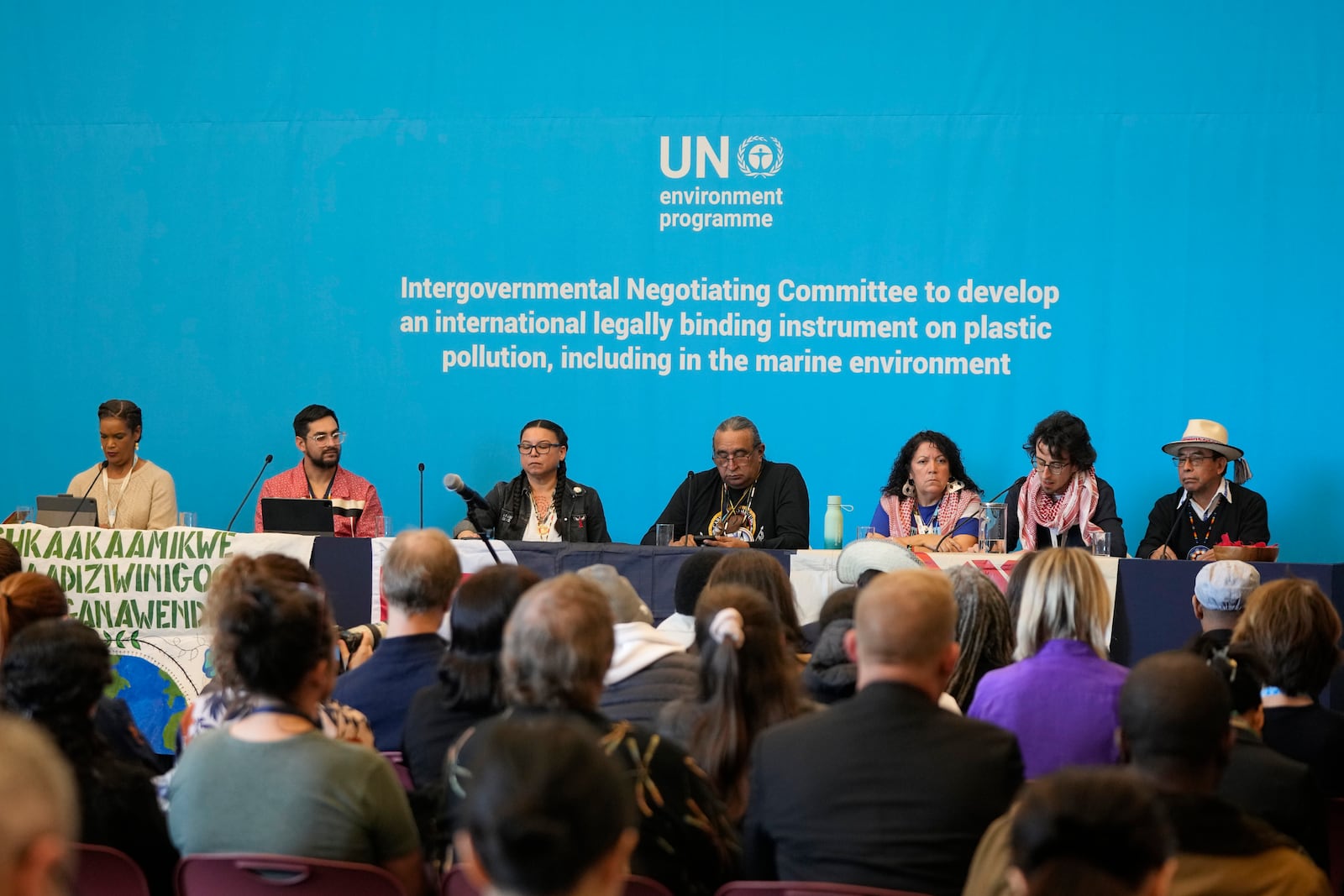 Members of The International Indigenous Peoples' Forum on Plastics attend a press conference at the fifth session of the Intergovernmental Negotiating Committee on Plastic Pollution in Busan, South Korea, Saturday, Nov. 30, 2024. (AP Photo/Ahn Young-joon)