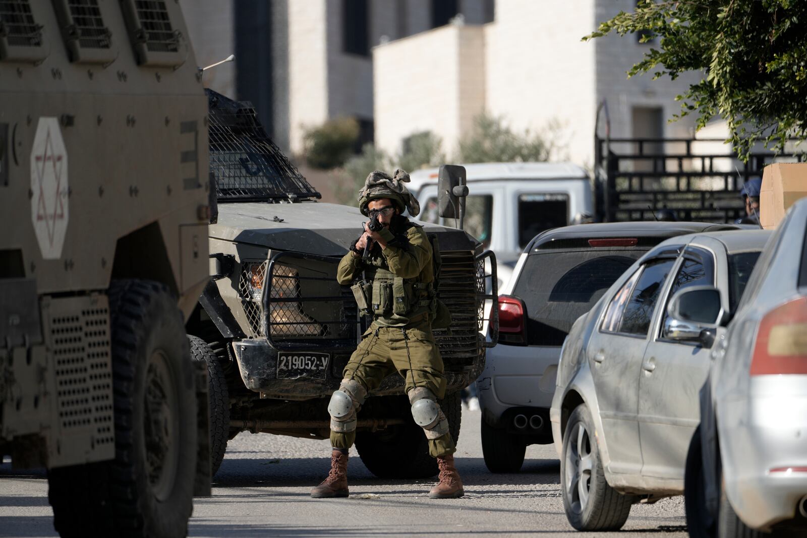 Israeli troops enter the complex of the Turkish hospital, where they searched for the bodies of those killed in an airstrike, in the West Bank city of Tubas, Tuesday Dec. 3, 2024. (AP Photo/Majdi Muhammad)