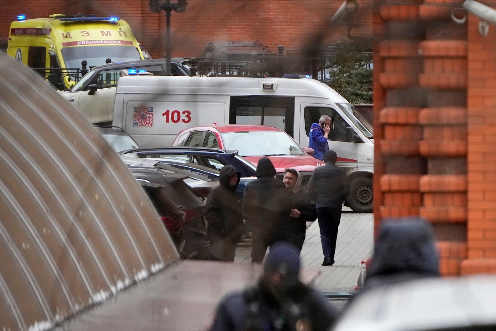 An ambulance stands in the yard of an upscale residential block in Moscow, Russia, Monday, Feb. 3, 2025, where the blast has killed one person and wounded four others, Russian news agencies say. (AP Photo/Alexander Zemlianichenko)