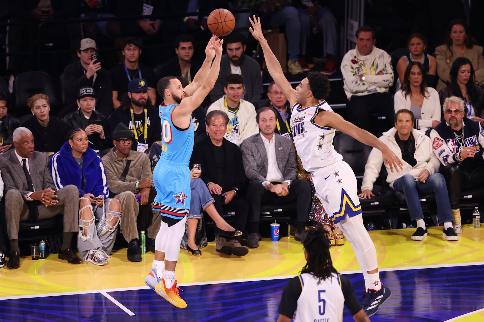 Golden State Warriors guard Stephen Curry makes a 3-point basket during the NBA All-Star basketball game Sunday, Feb. 16, 2025, in San Francisco. (AP Photo/Jed Jacobsohn)