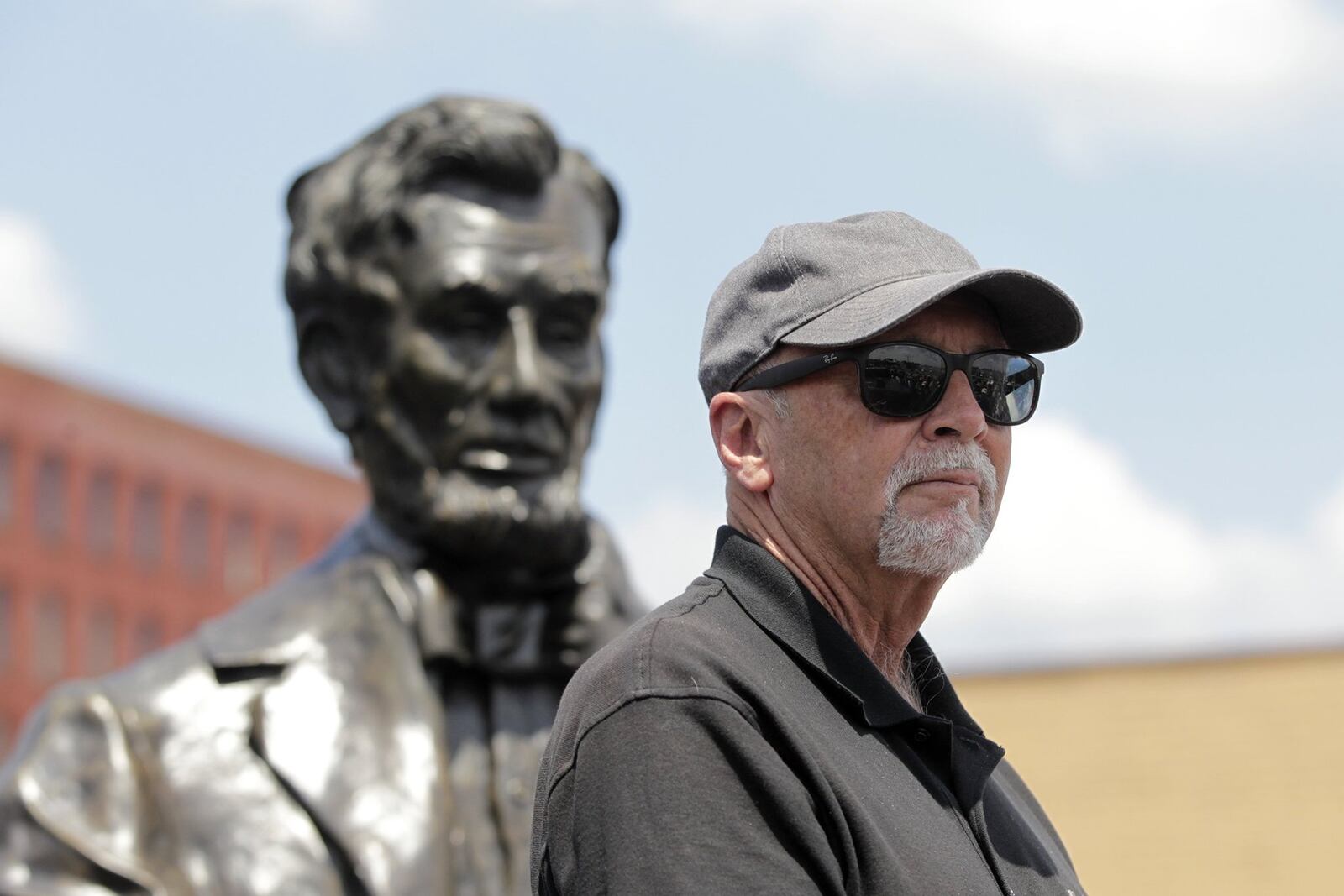 A 1,700 pound bronze sculpture of Abraham Lincoln created by Urbana artist Mike Major (pictured) was delivered to Dayton Tuesday. The statue will be placed in a park at the Dayton VA Medical Center campus in the fall. LISA POWELL / STAFF