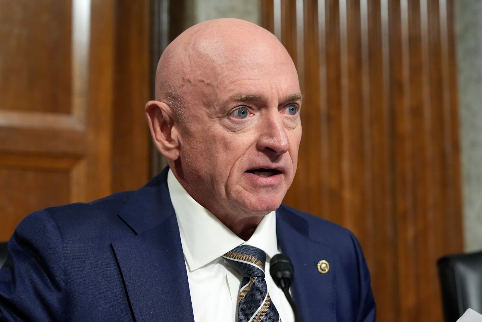 Sen. Mark Kelly, D-Ariz. speaks at the Senate Armed Services Committee for his confirmation hearing of Pete Hegseth, President-elect Donald Trump's choice to be Defense secretary, at the Capitol in Washington, Tuesday, Jan. 14, 2025. (AP Photo/Alex Brandon)