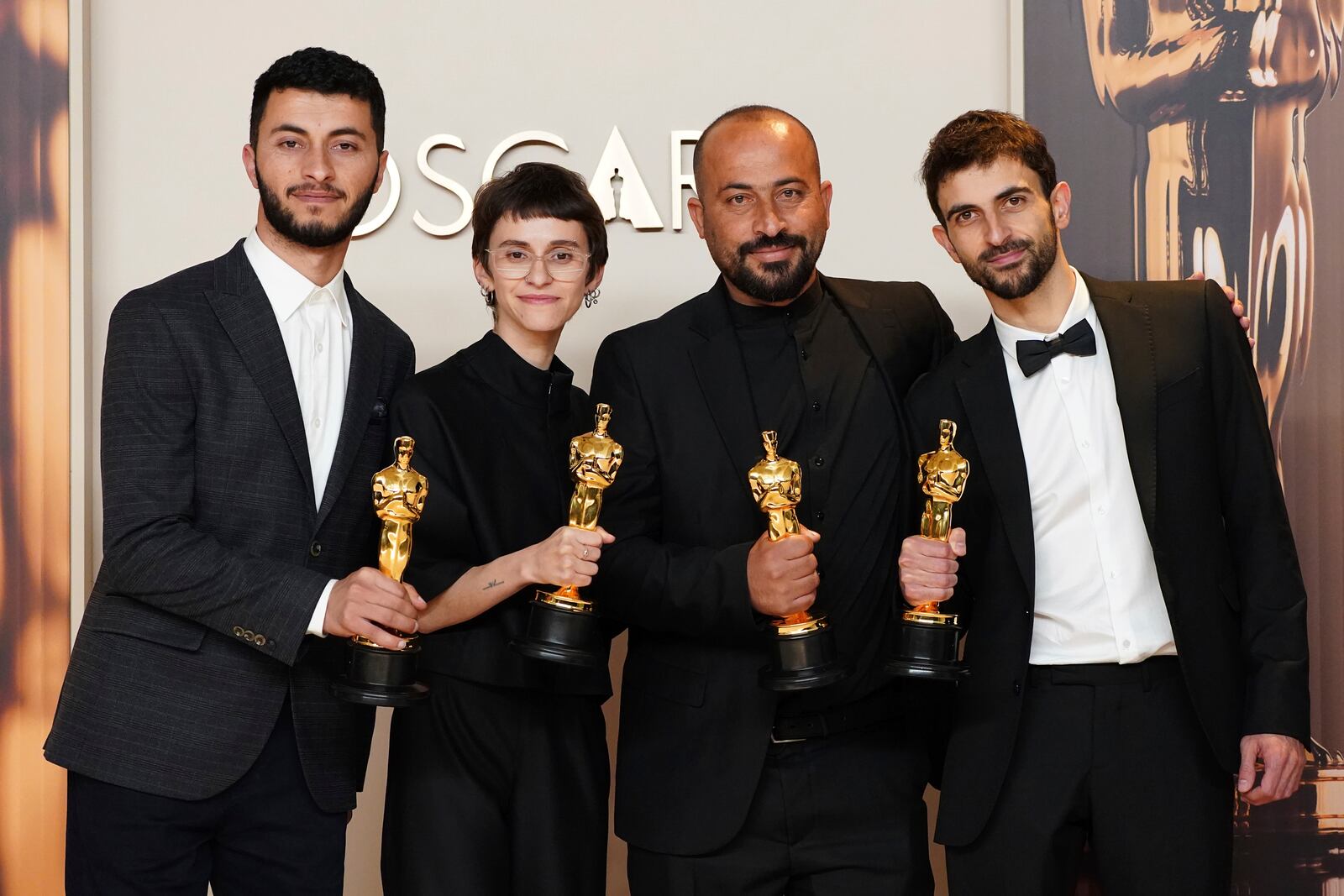 Basel Adra, from left, Rachel Szor, Hamdan Ballal, and Yuval Abraham, winners of the award for best documentary feature film for "No Other Land," pose in the press room at the Oscars on Sunday, March 2, 2025, at the Dolby Theatre in Los Angeles. (Photo by Jordan Strauss/Invision/AP)