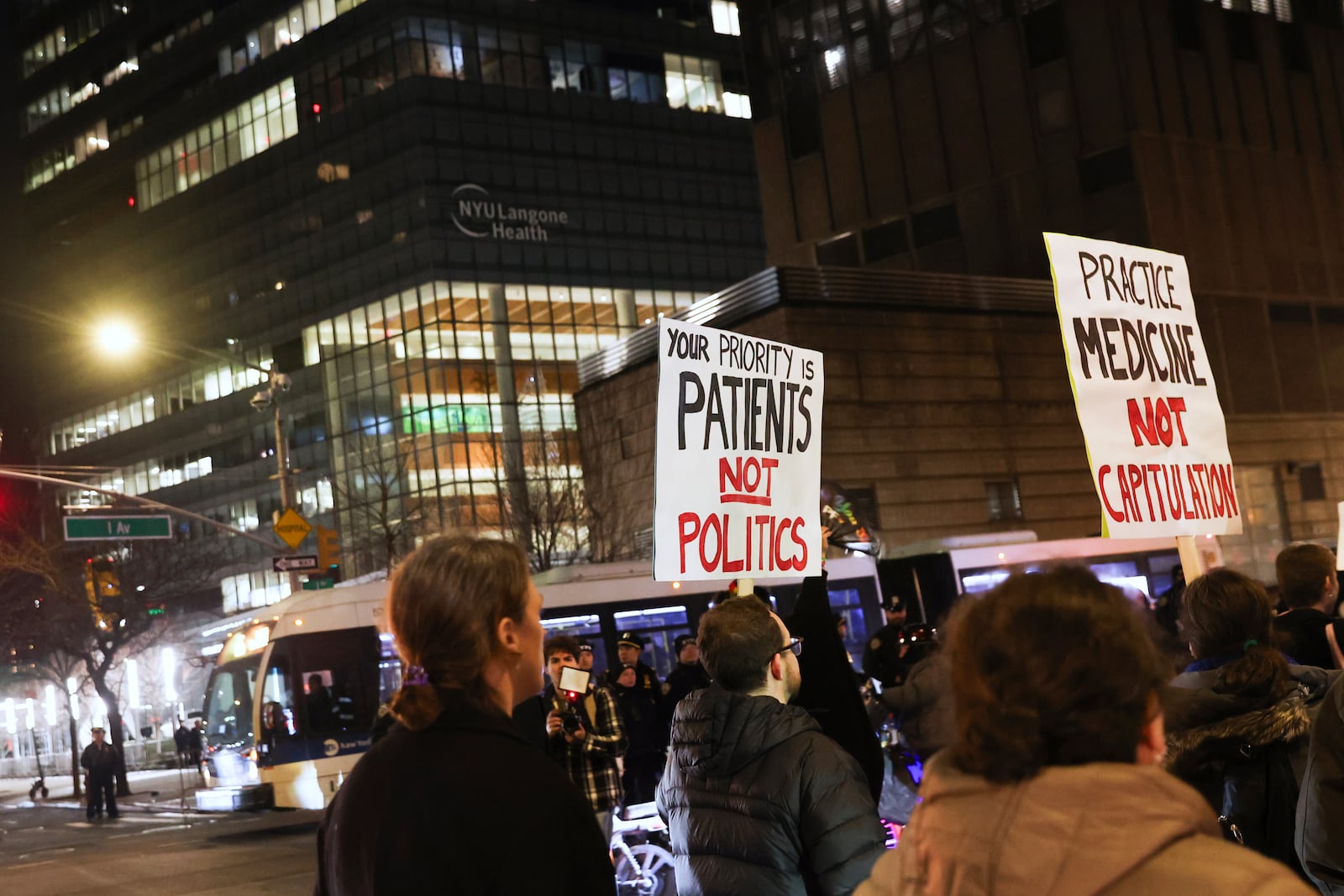 People march past NYU Langone Health during a rally demanding that NYU Langone commit to providing gender-affirming care for transgender youth, Monday, Feb. 3, 2025, in New York. (AP Photo/Heather Khalifa)