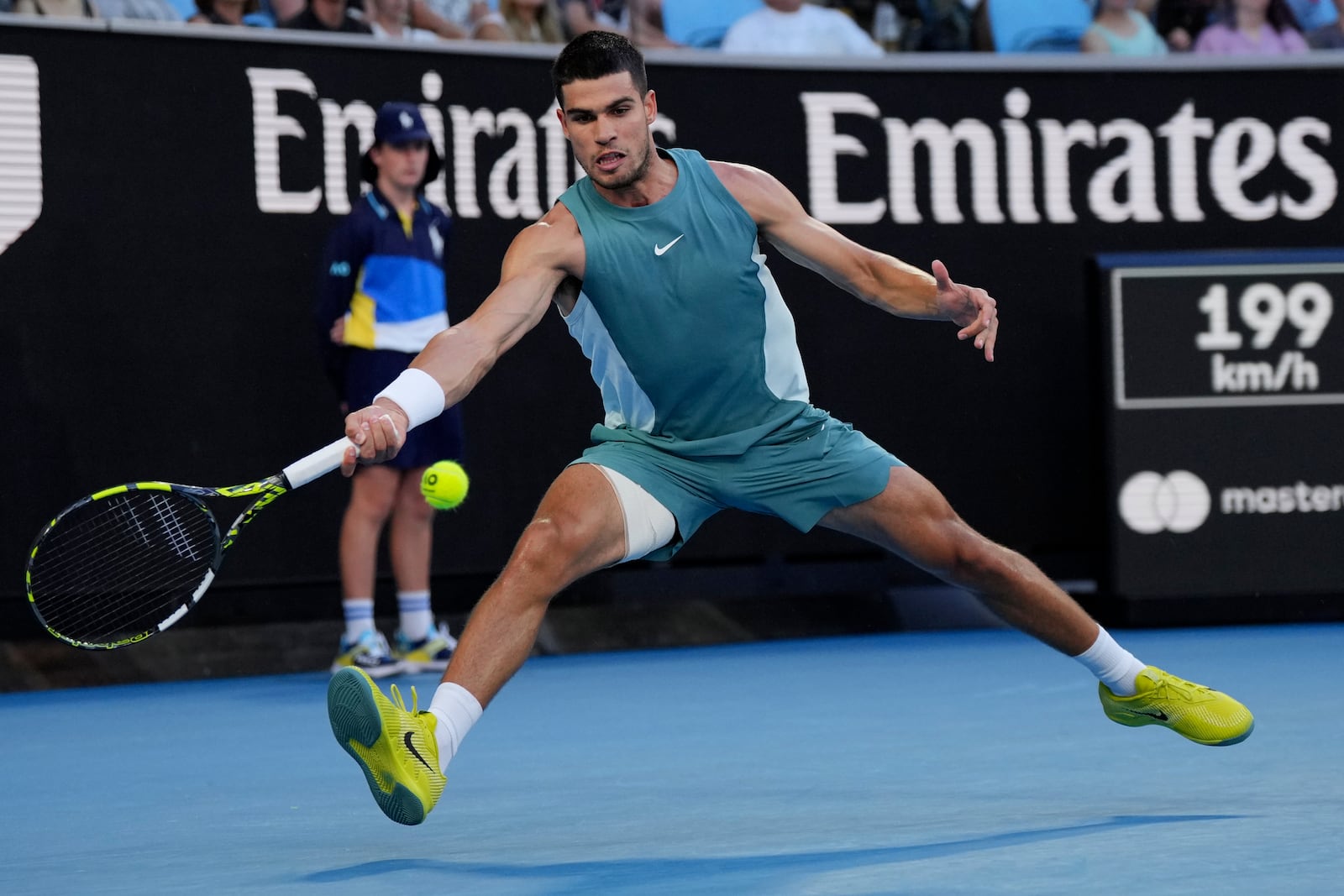 Carlos Alcaraz of Spain plays a forehand return to Alexander Shevchenko of Kazakhstan during their first round match at the Australian Open tennis championship in Melbourne, Australia, Monday, Jan. 13, 2025. (AP Photo/Vincent Thian)