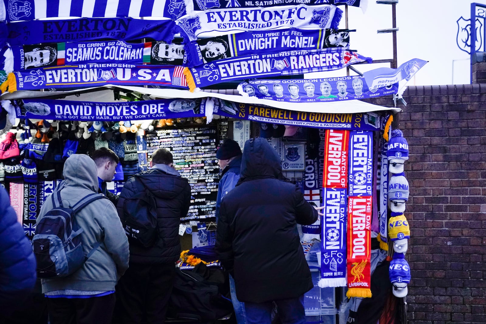 Fans outside of the Goodison Park stadium ahead of the English Premier League soccer match between Everton and Liverpool in Liverpool, England, Wednesday, Feb.12, 2025. (AP Photo/Dave Thompson)