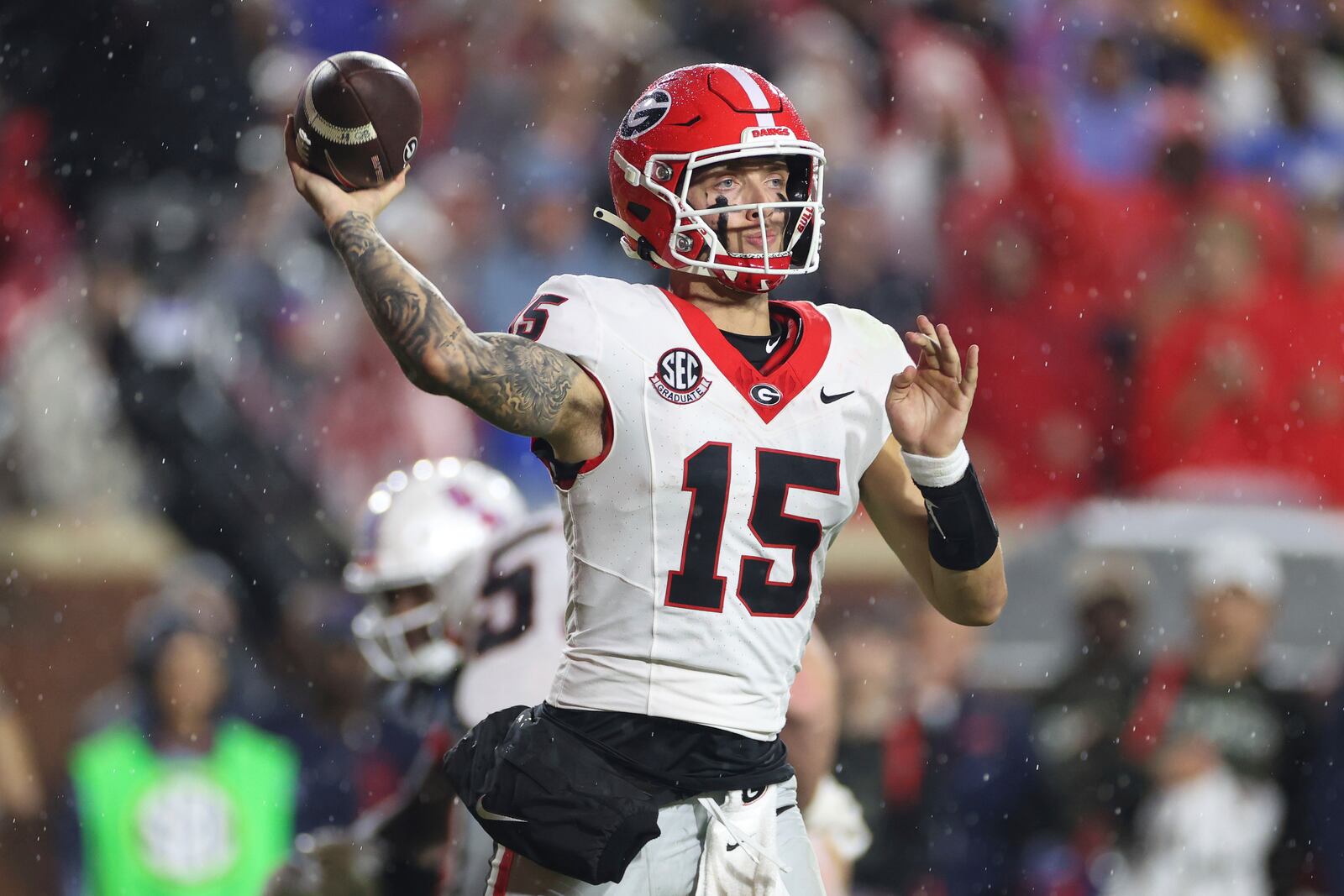 Georgia quarterback Carson Beck (15) throws the ball during the second half of an NCAA college football game against Mississippi on Saturday, Nov. 9, 2024, in Oxford, Miss. Mississippi won 28-10. (AP Photo/Randy J. Williams)